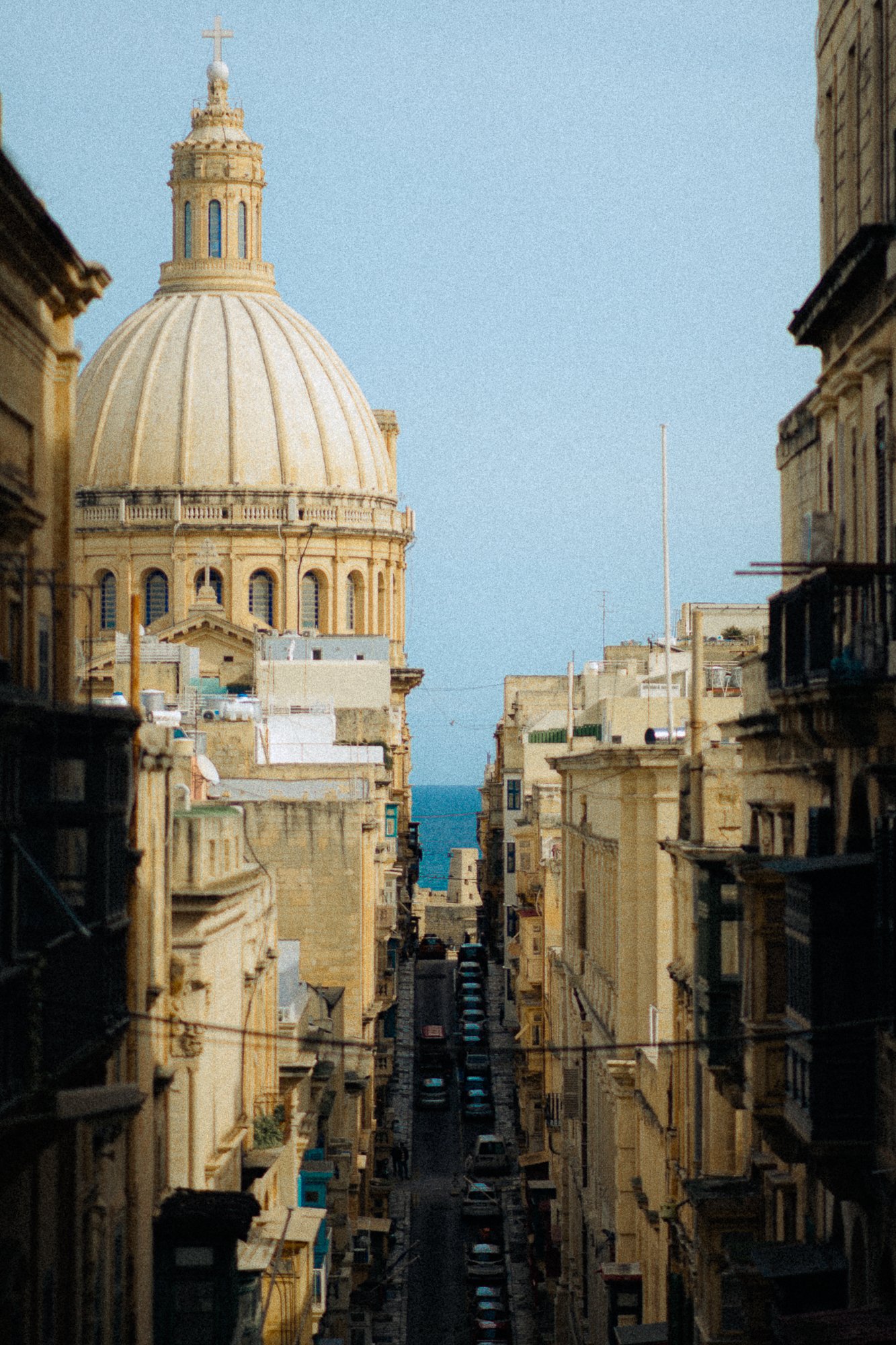 Historic city view with a large dome and sea beyond, timeless destination imagery for boutique hotel marketing