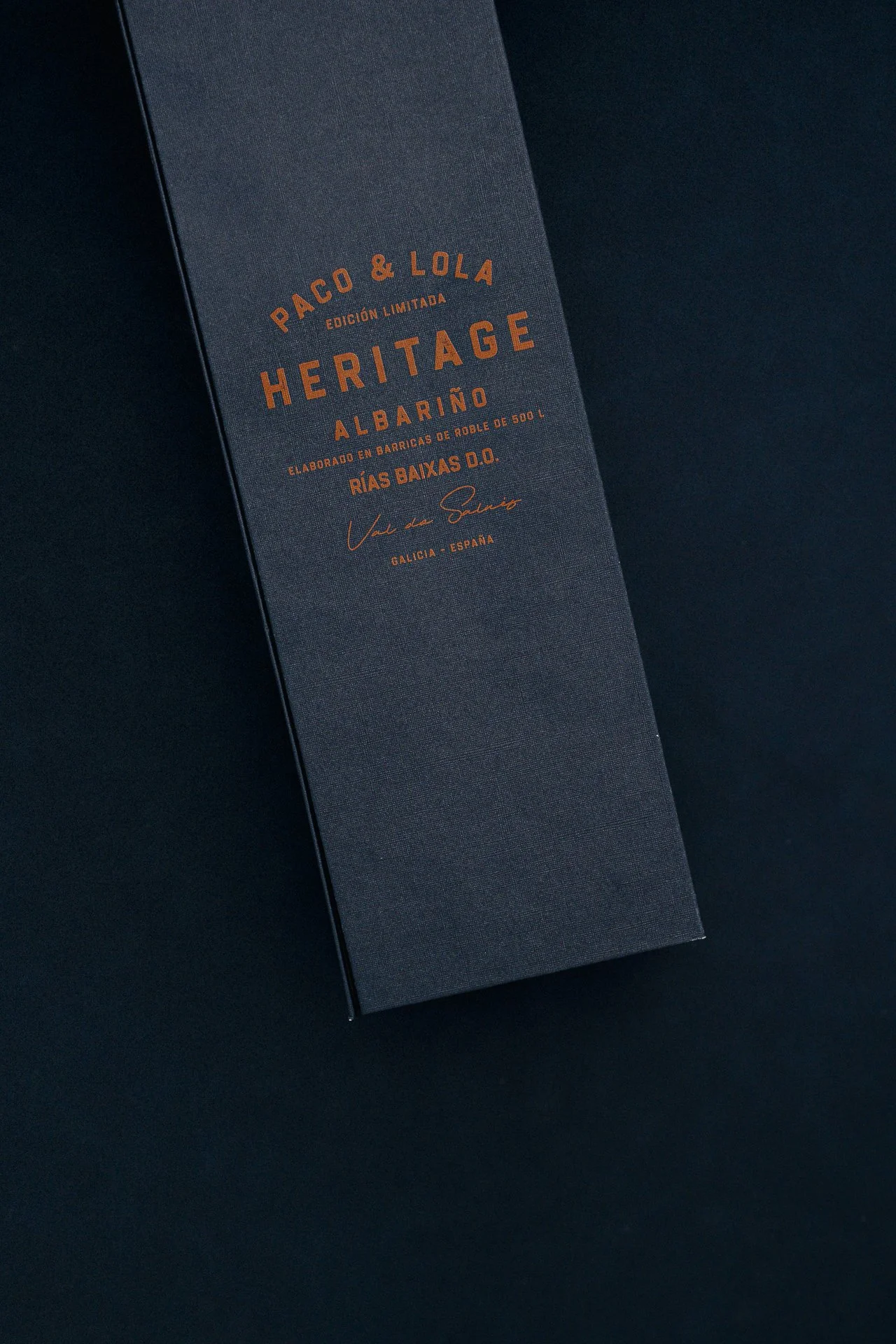 Embossed label detail in low light, premium texture close-up for luxury hotel and restaurant brand visuals