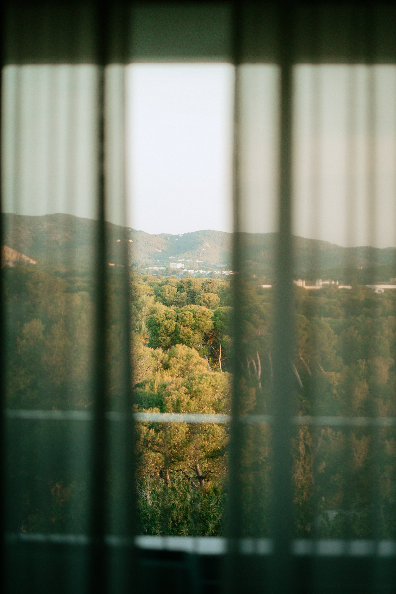 Scenic view through sheer curtains, serene room atmosphere for quiet stays and boutique hotel marketing in Catalunya