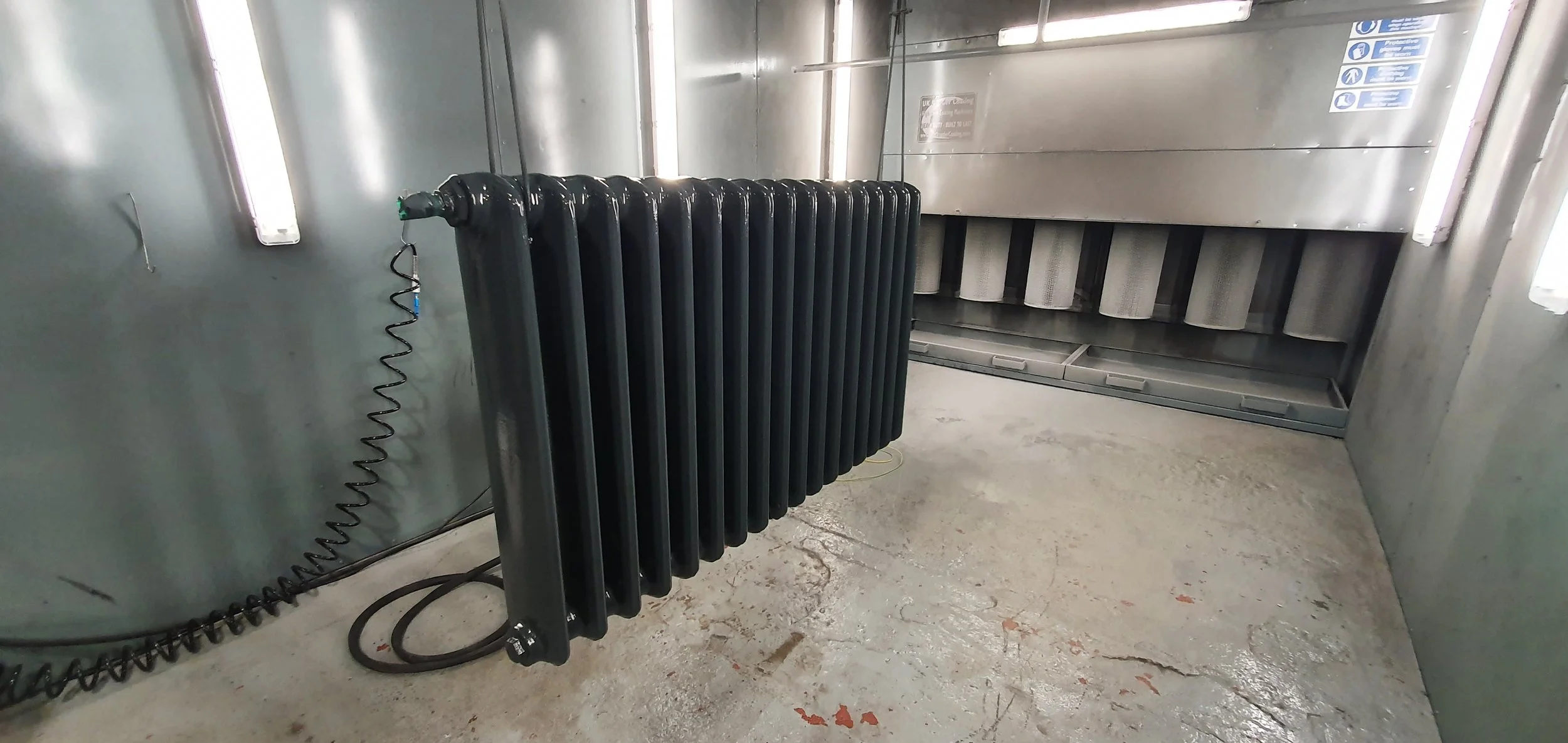 Cast iron radiator being refurbished