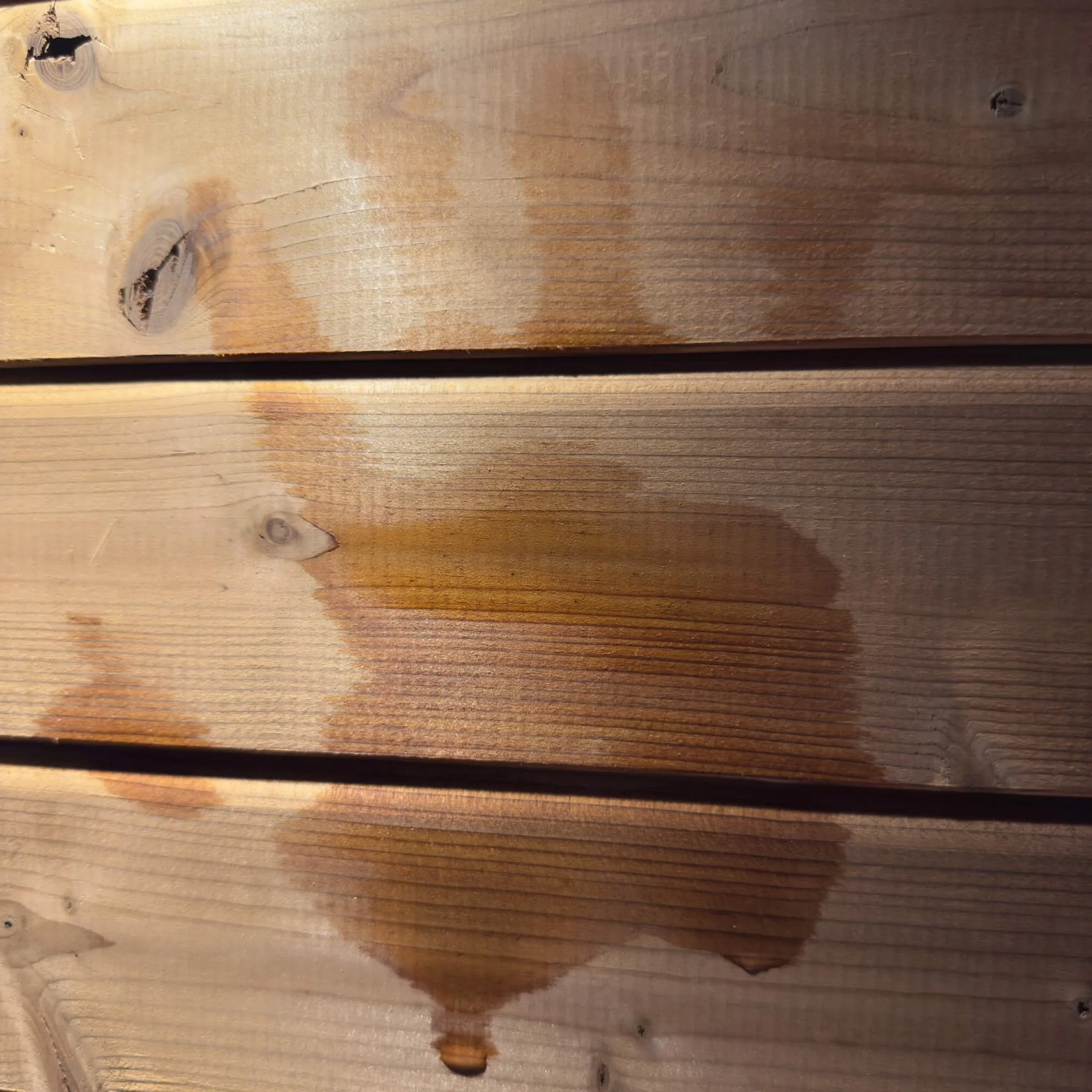 Water stain on a wooden surface.
