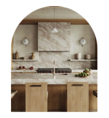 Modern kitchen with marble backsplash, wooden island, and pendant lights