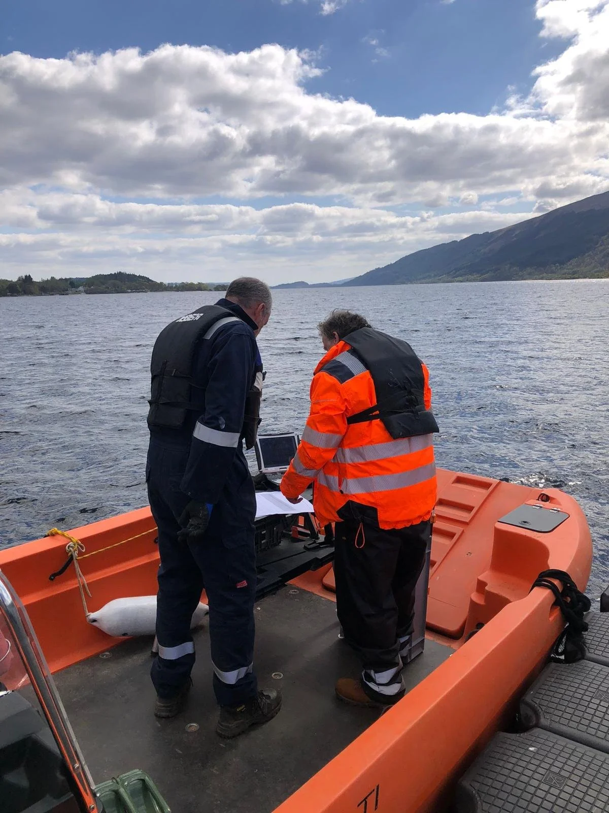 Two people on Pioneer Multi Safety Boat