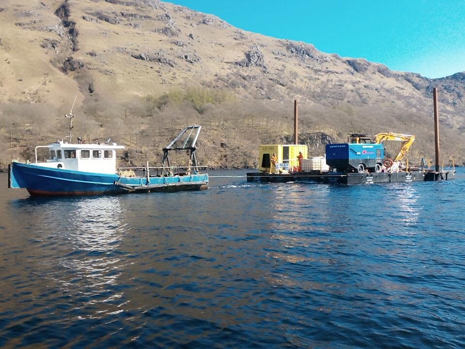 Work boat pulling barge on Loch Lomond