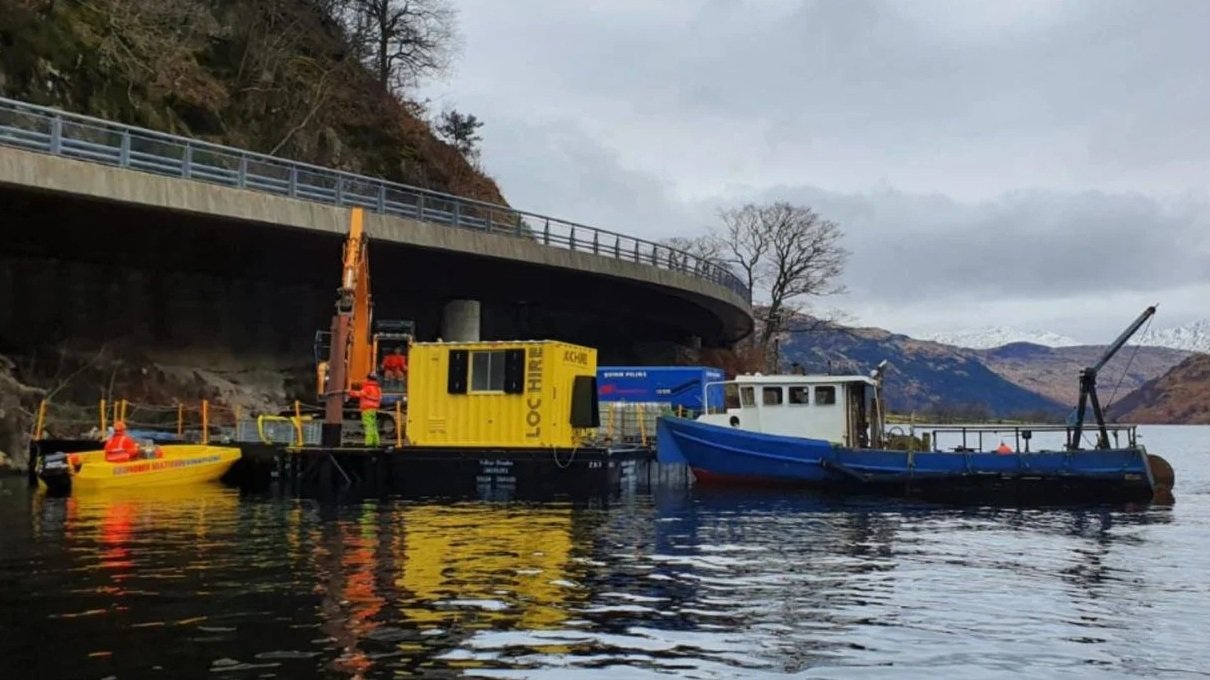 Work Boat with digger on Floating Pontoon