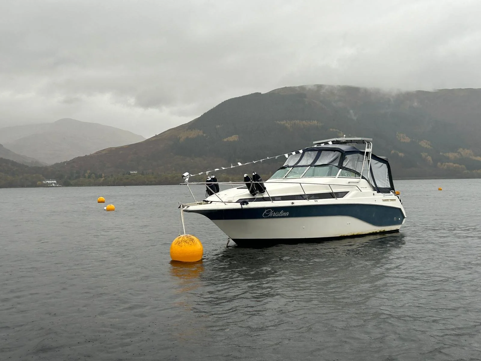 Boat Mooring in Loch Lomond on a cloudy day
