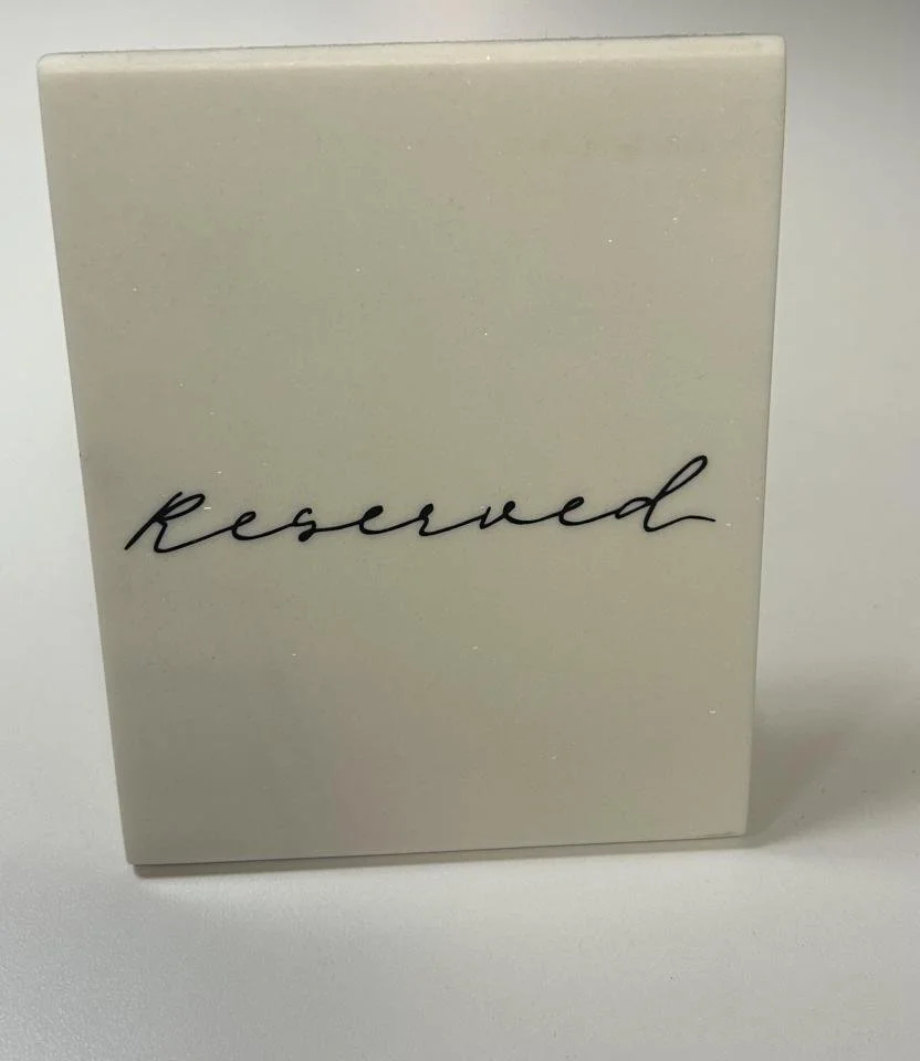 White Stone "Reserved" Sign