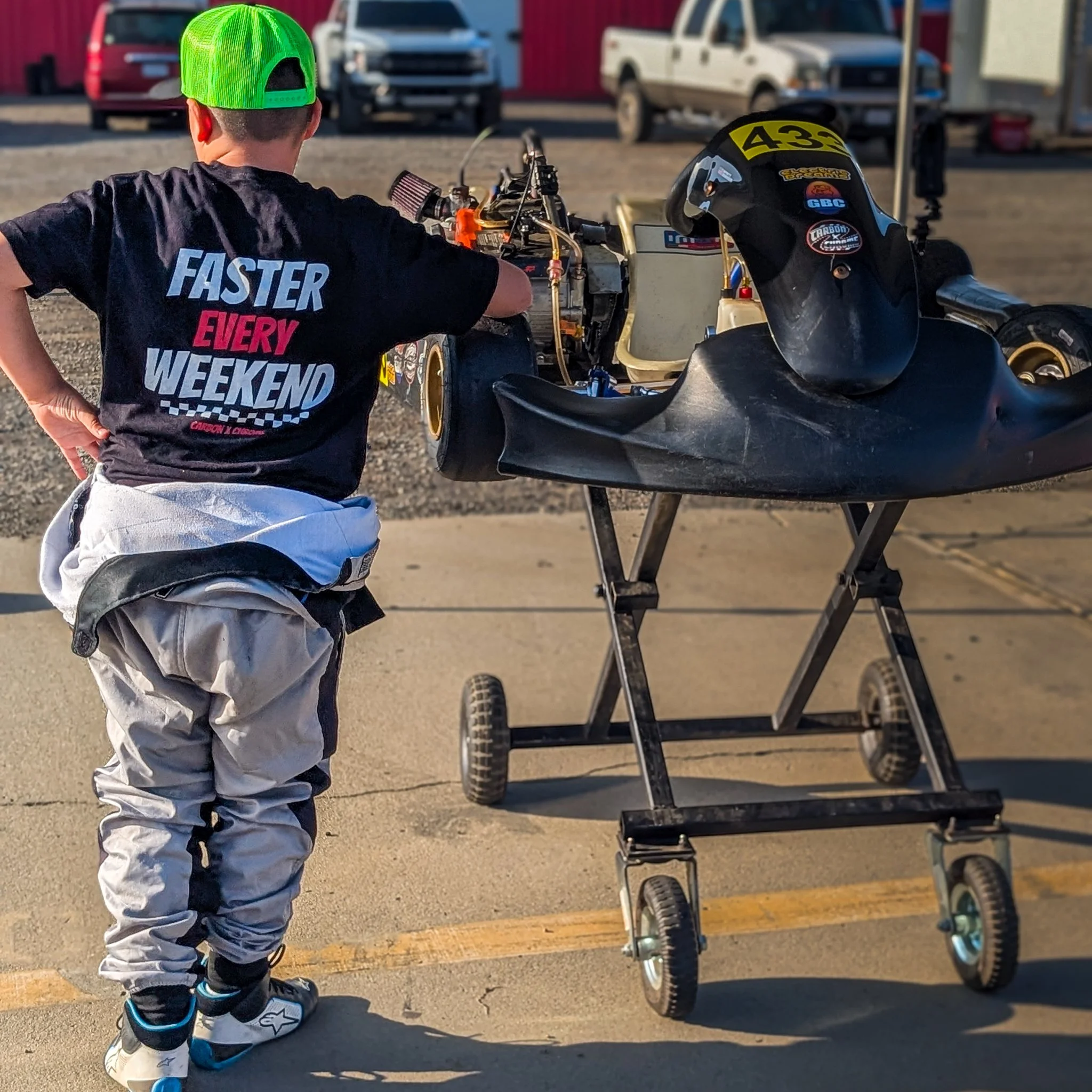 Faster Every Weekend Carbon x Chrome racing shirt at the kart track