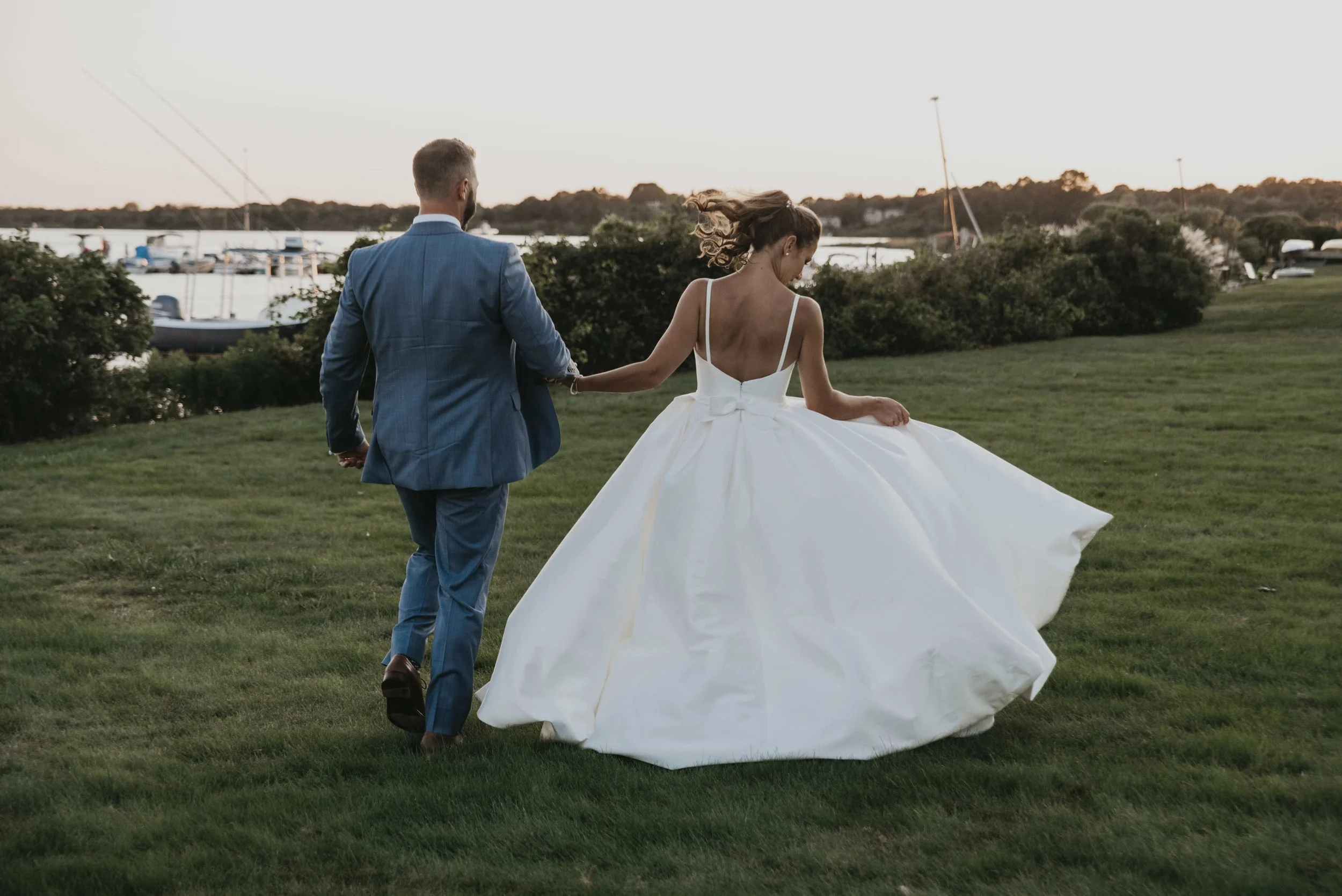 blue rocks catering-bride and groom on the water.jpeg