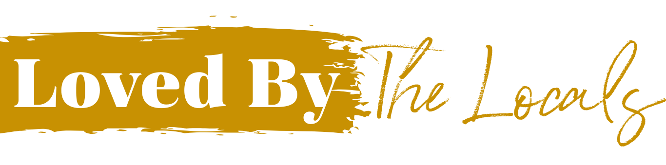 Logo with the words "Loved By The Locals" in white and gold text on a black background.