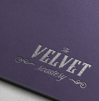 Purple notebook with silver embossed text reading "The Velvet MemorY".