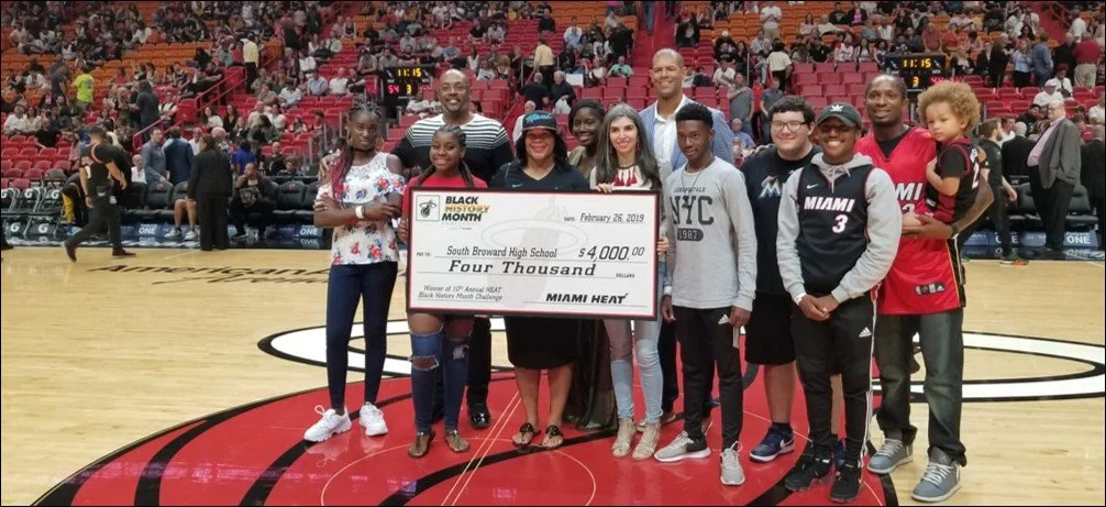 Dr. Pittman with students, community members, and Miami Heat legends, after winning the annual Miami Heat Black History Month Challenge in 2020.