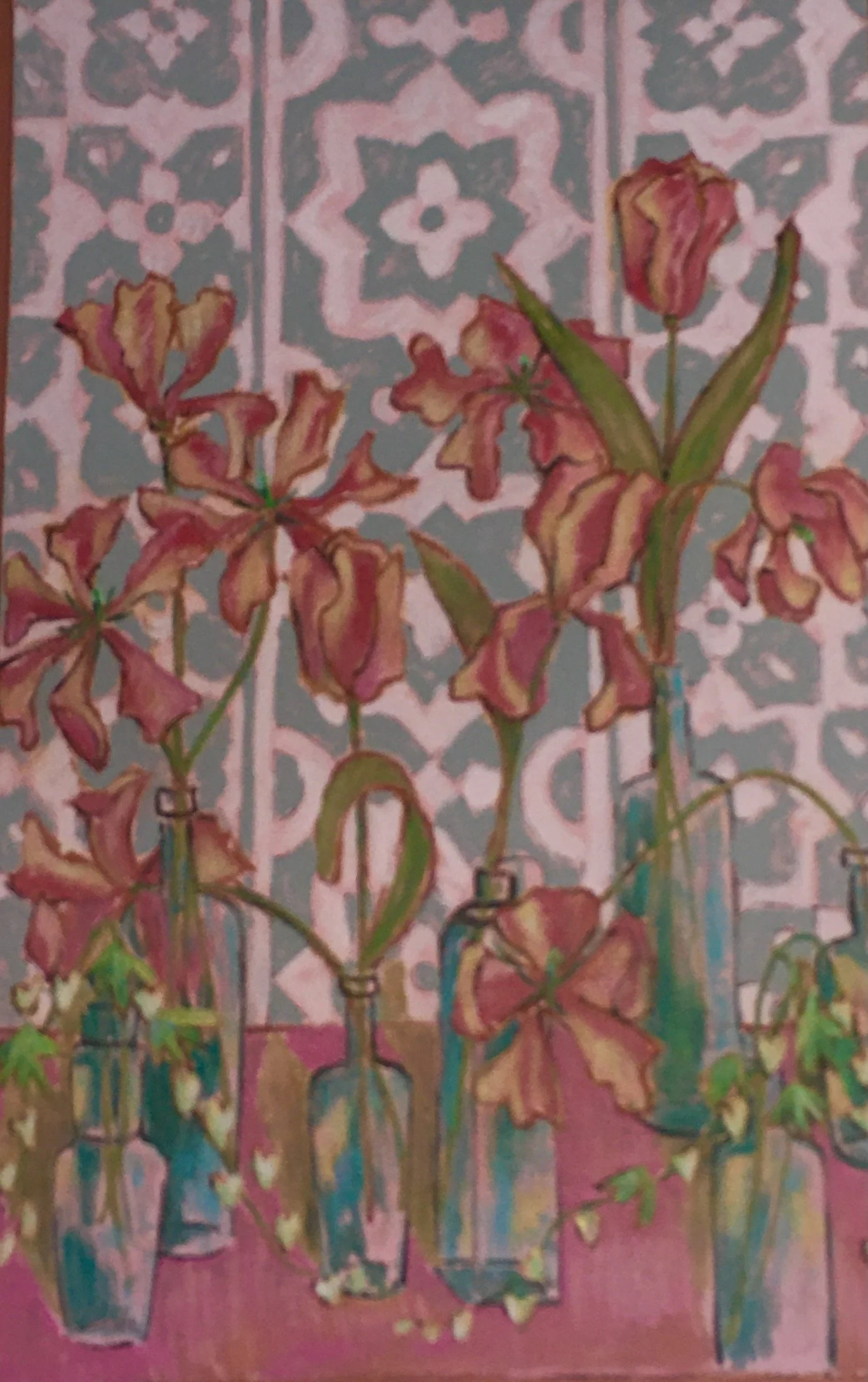 Watercolor painting of flowers in glass vases against a patterned background.