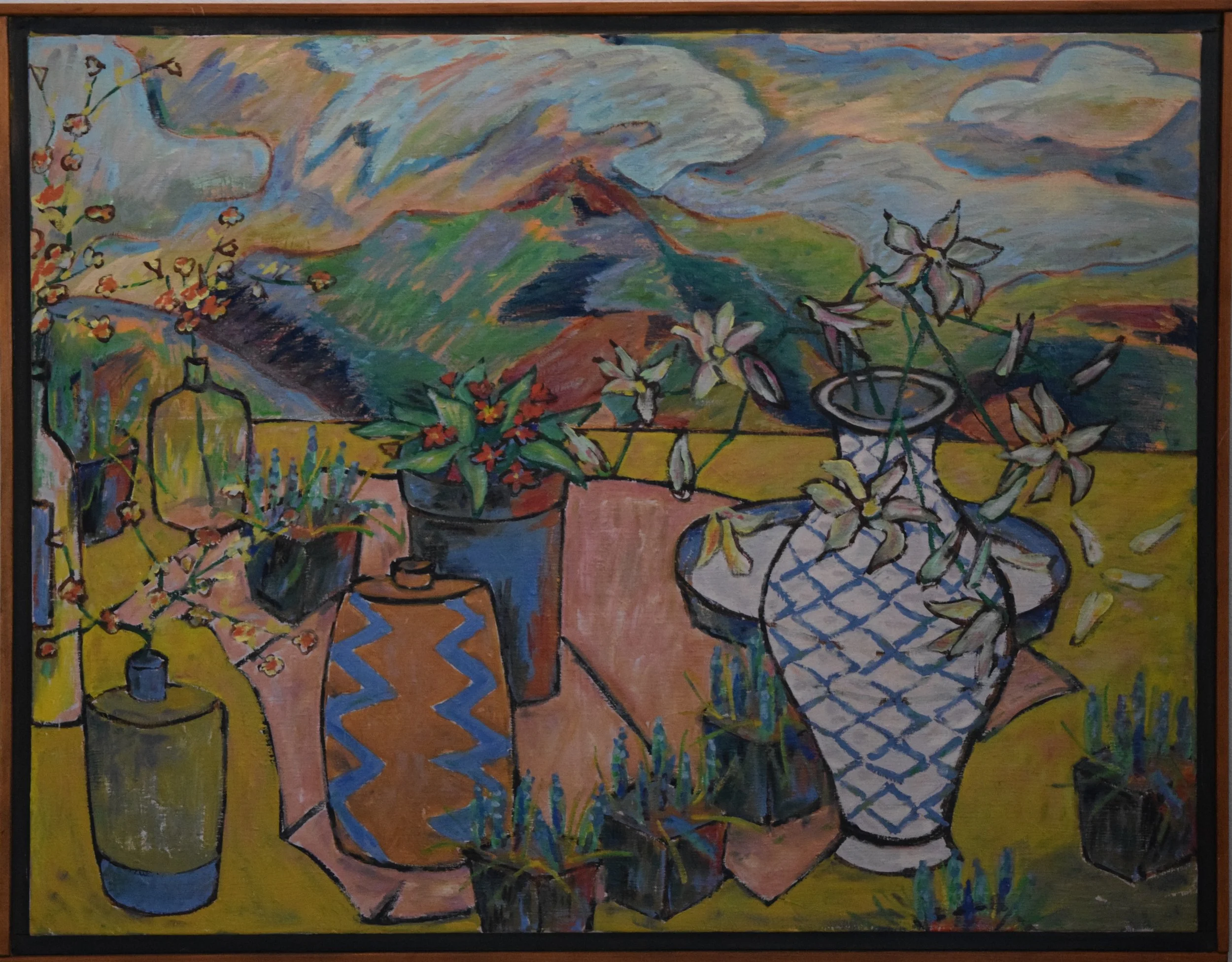 Colorful still life painting of various vases with flowers on a table, with a mountain landscape and clouds in the background.