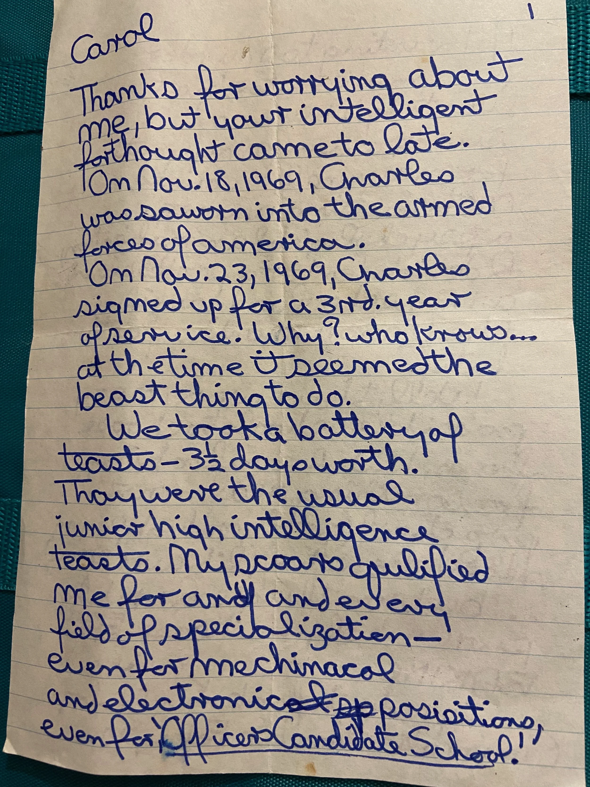 Handwritten letter on a piece of lined paper with blue ink text.