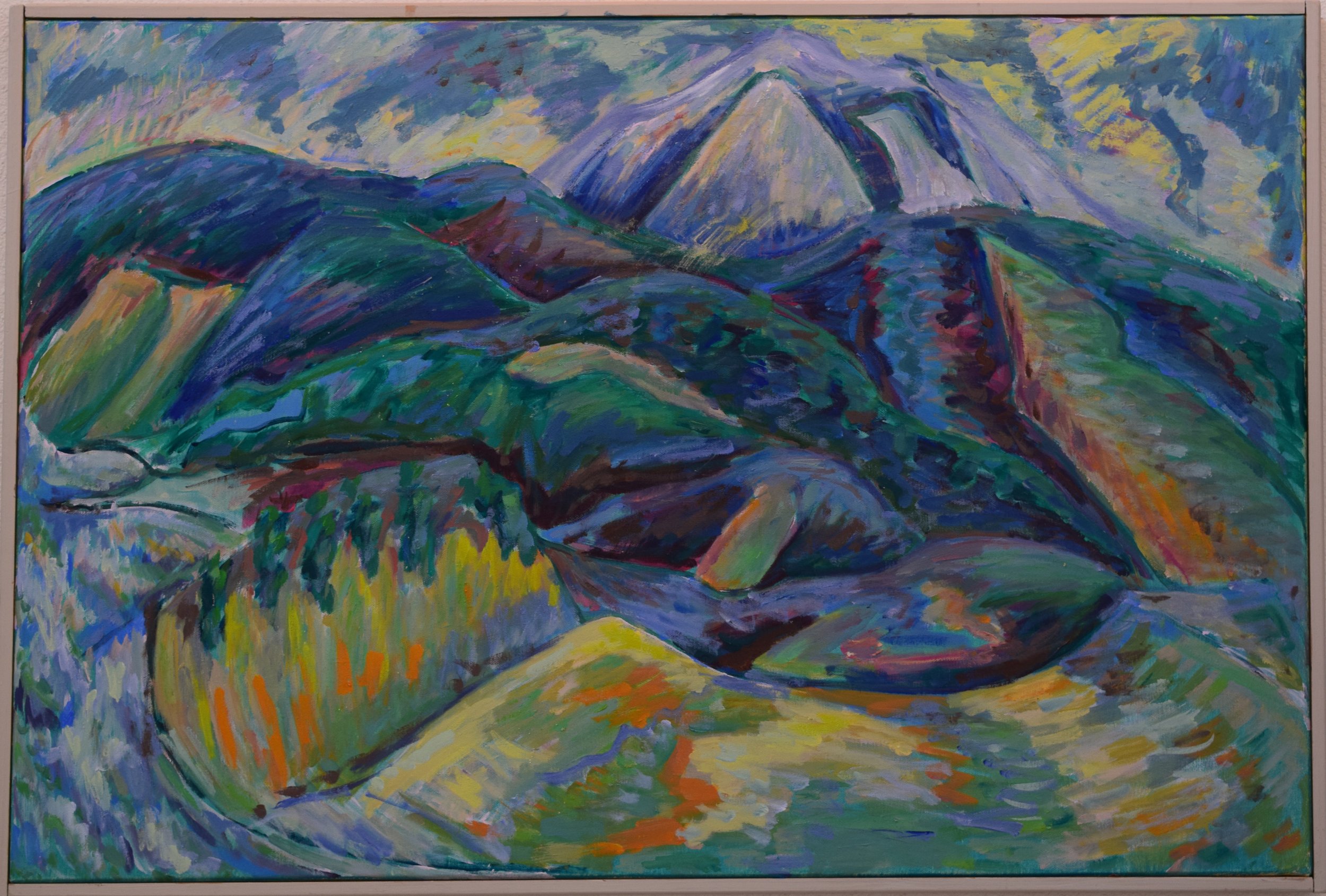 Colorful landscape painting of mountains with varying shades of blue, green, yellow, orange, and purple, featuring a prominent snow-capped peak in the background.