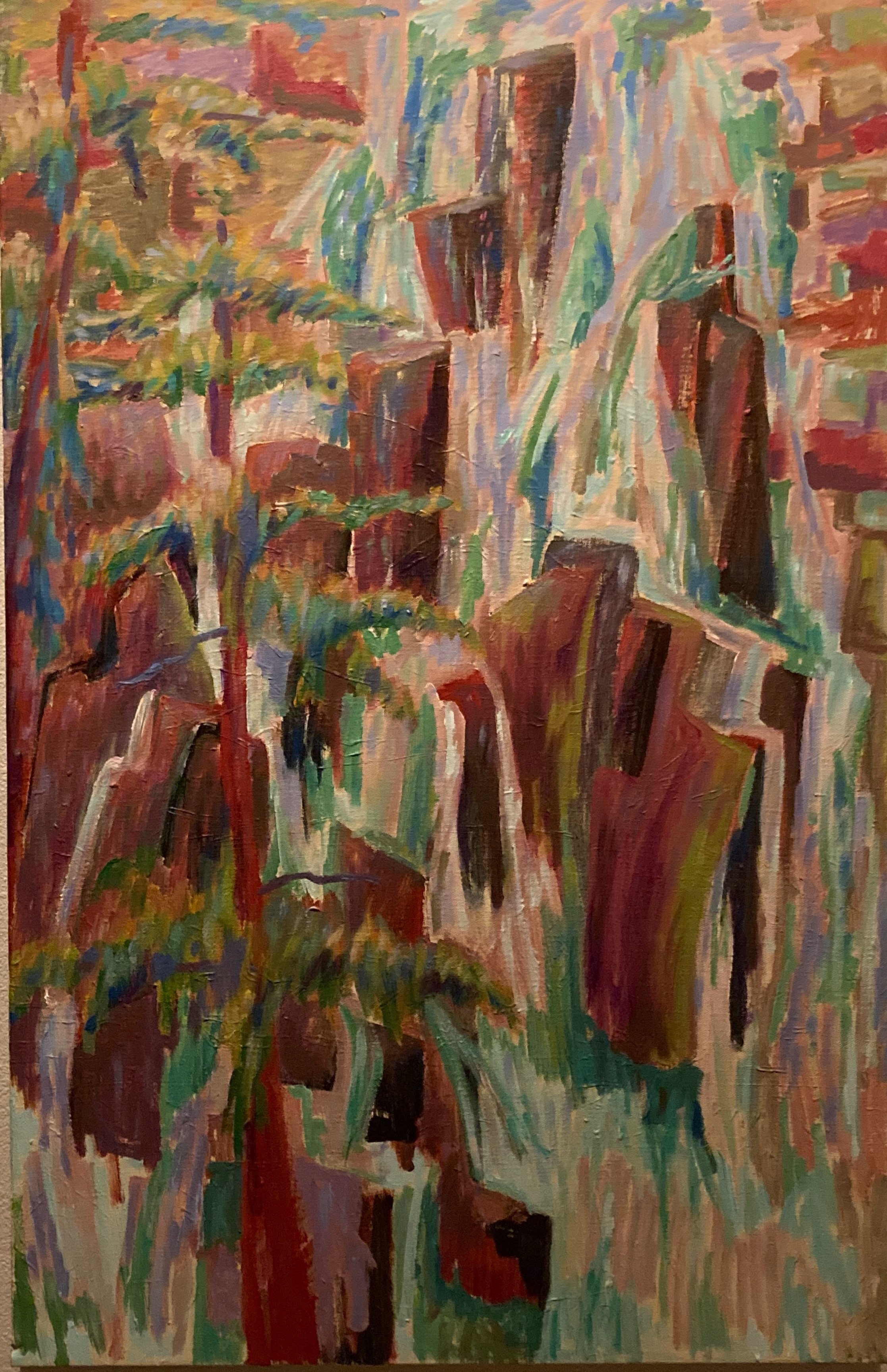 An abstract painting of a landscape with trees and rock formations using bold brushstrokes in earthy tones such as brown, red, green, and touches of blue and beige.