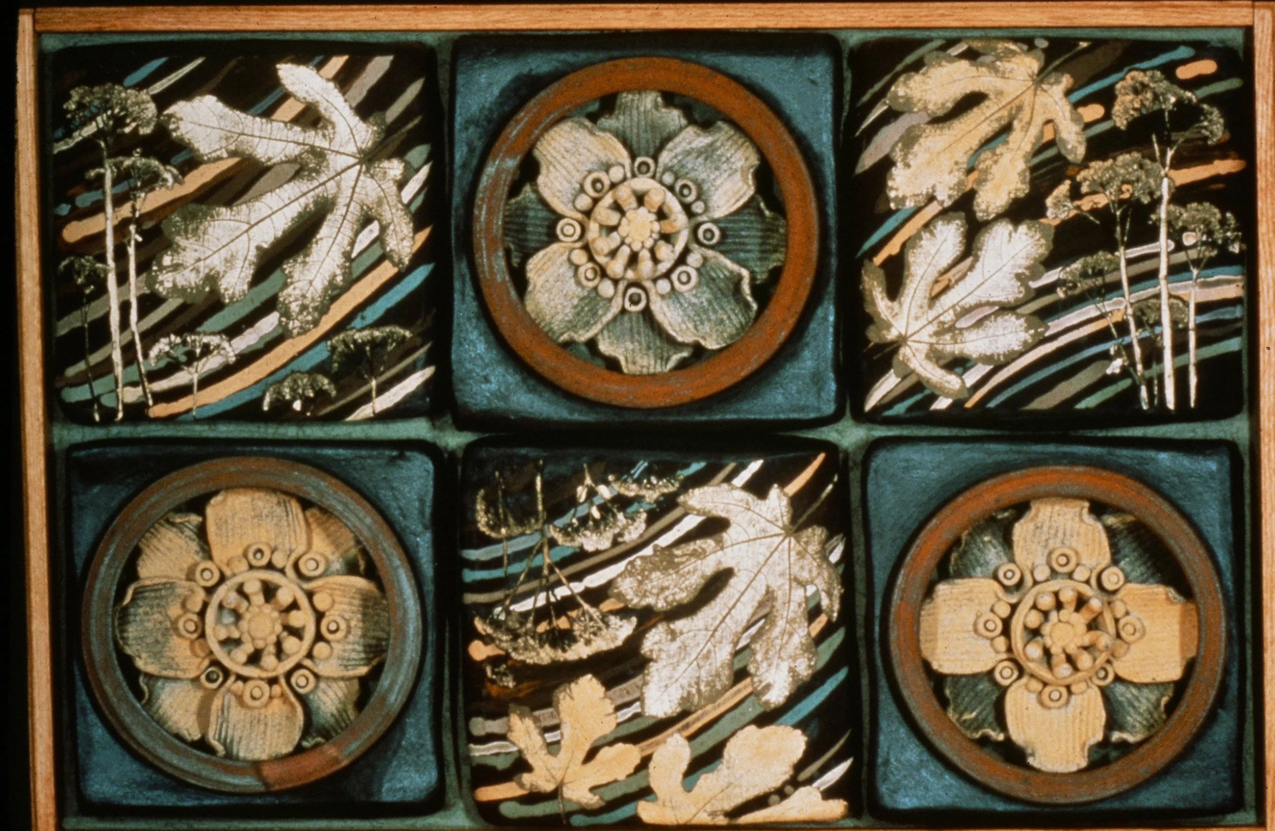 A handmade wooden tic-tac-toe game with geometric and floral designs, featuring hexagonal and circular carved pieces.