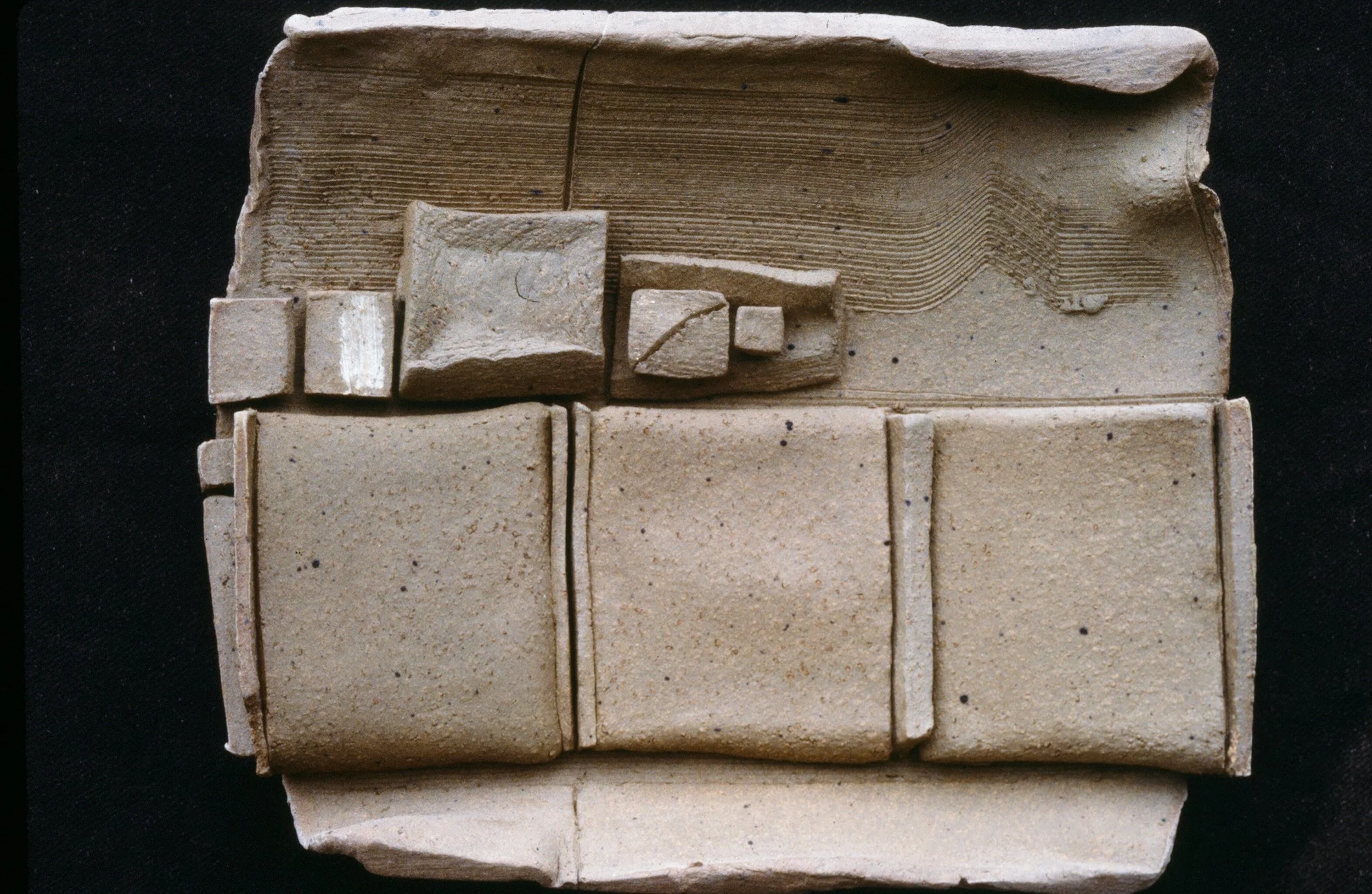 Ancient clay tablet inscribed with cuneiform script.