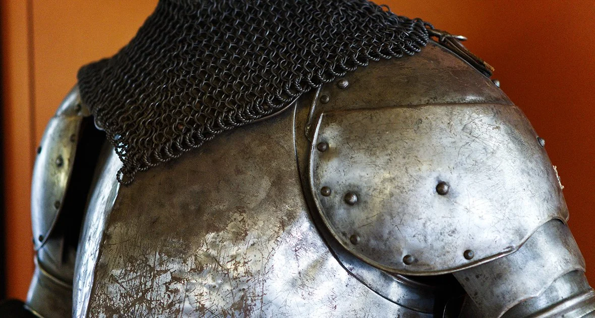 Close-up of medieval knight's suit of armor with chainmail collar.