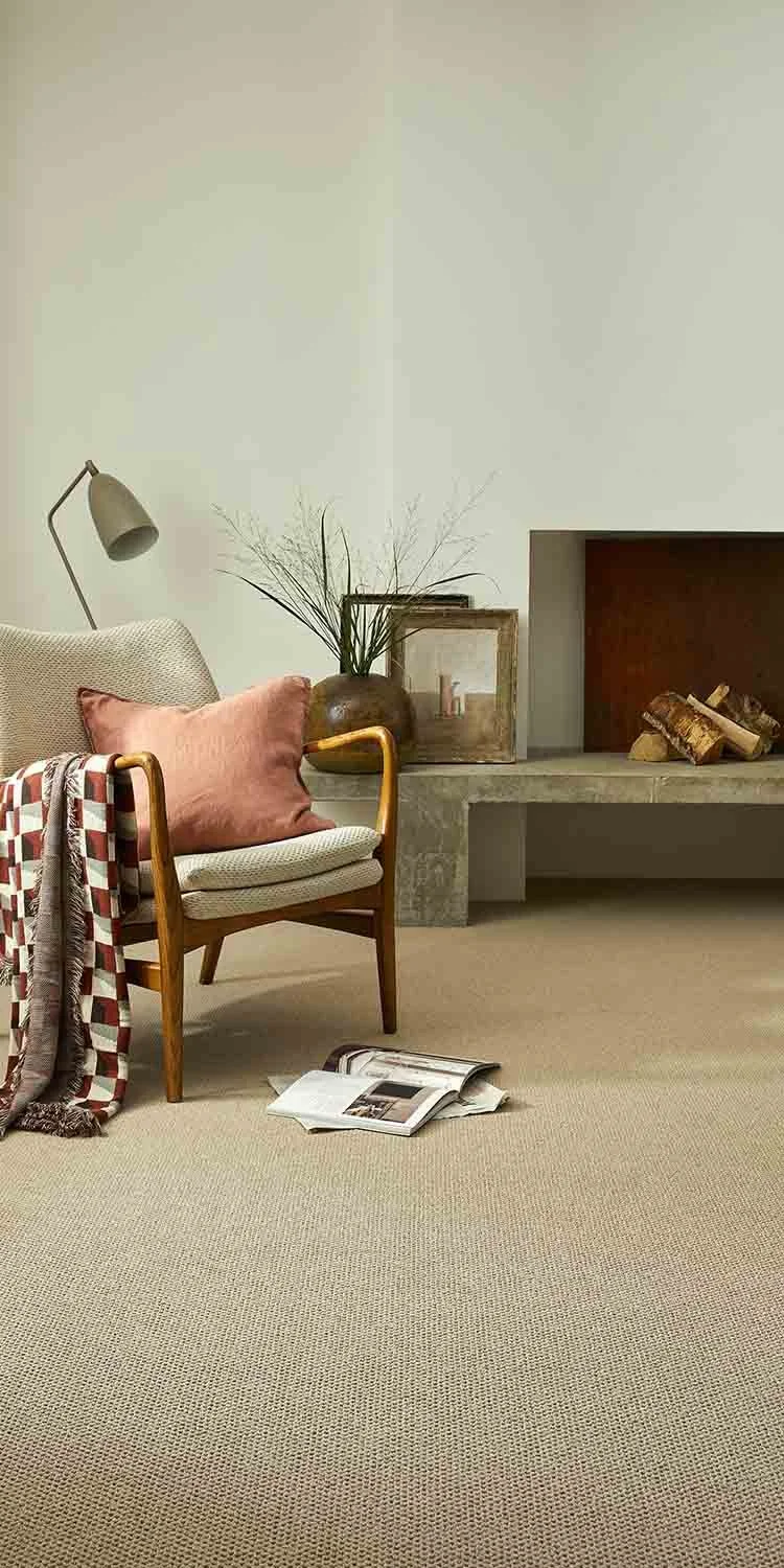 Practical carpets for homes in Cornwall - Neutral hard waring carpet with chair