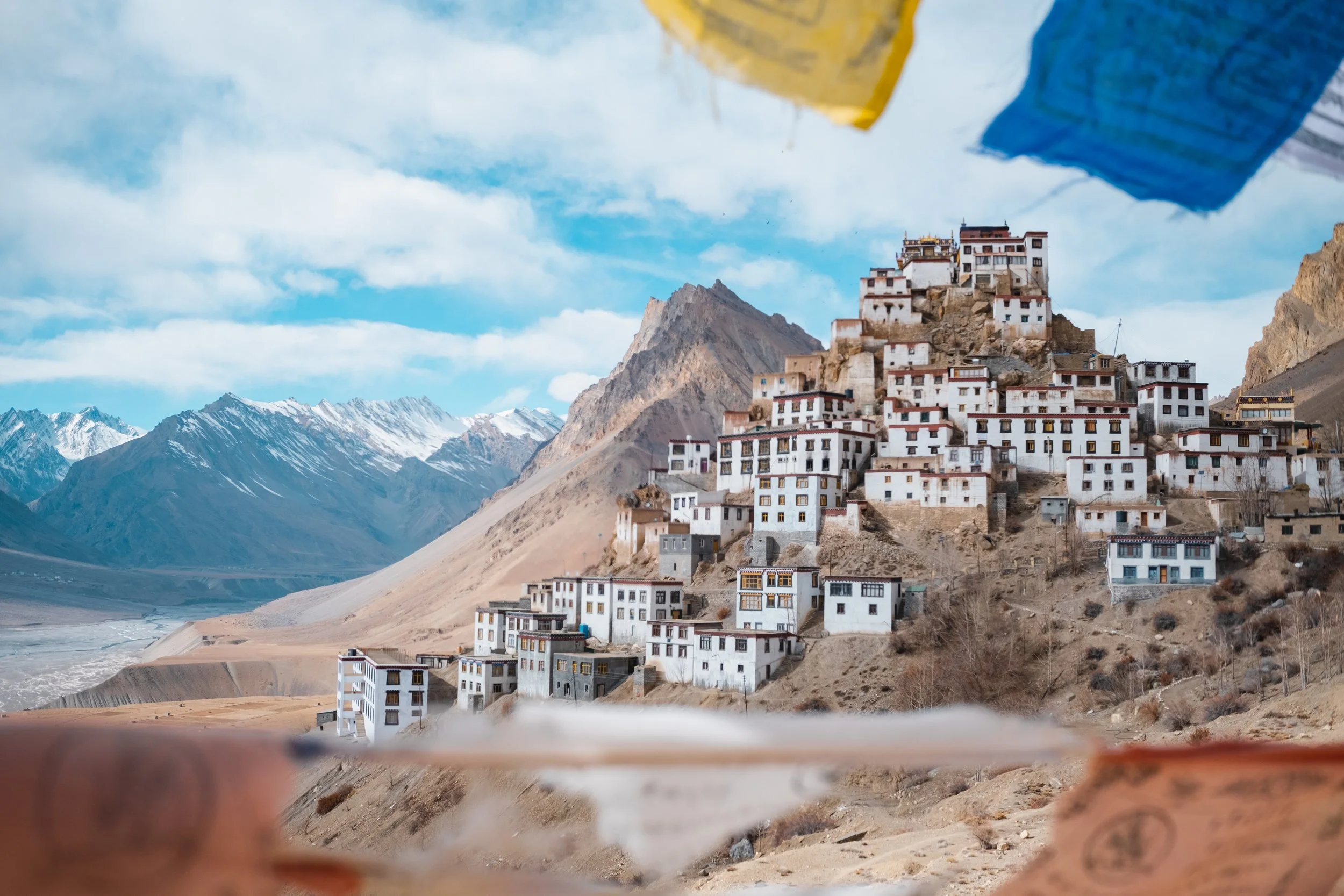 Kee Monastery village in the Himalayas, with snow-capped mountains in the background.





