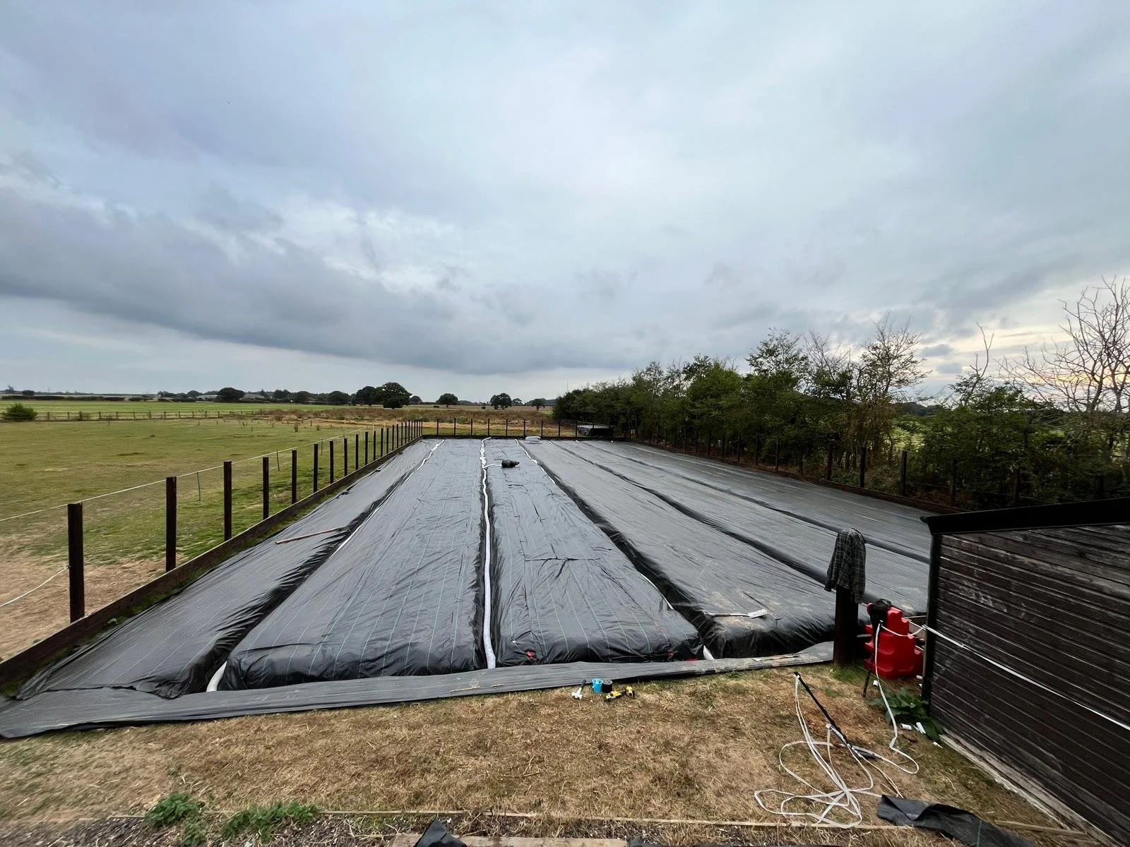 trenches dug and drainage pipes in ready for shingle 