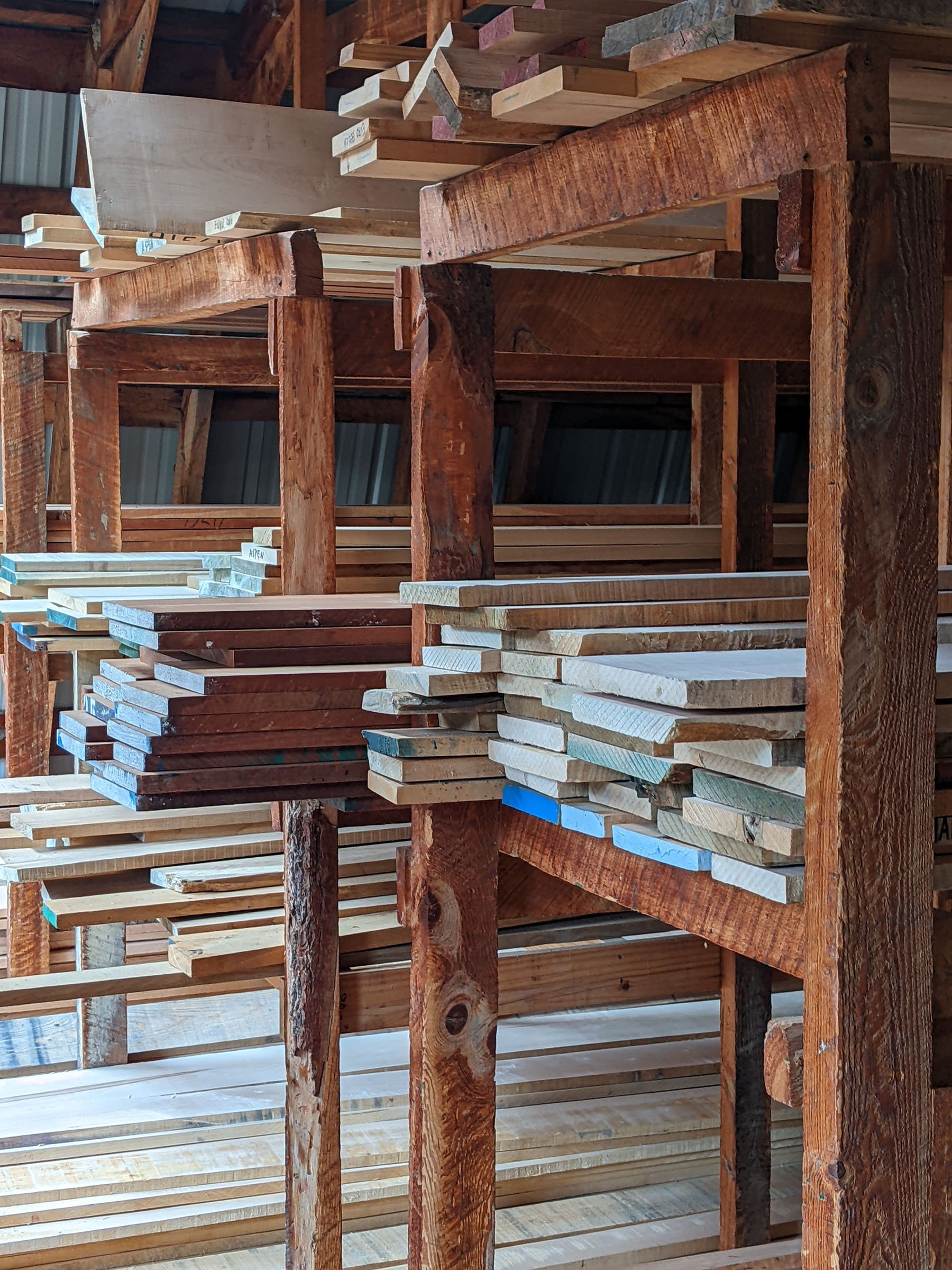 Stacks of lumber are shown in the loft.