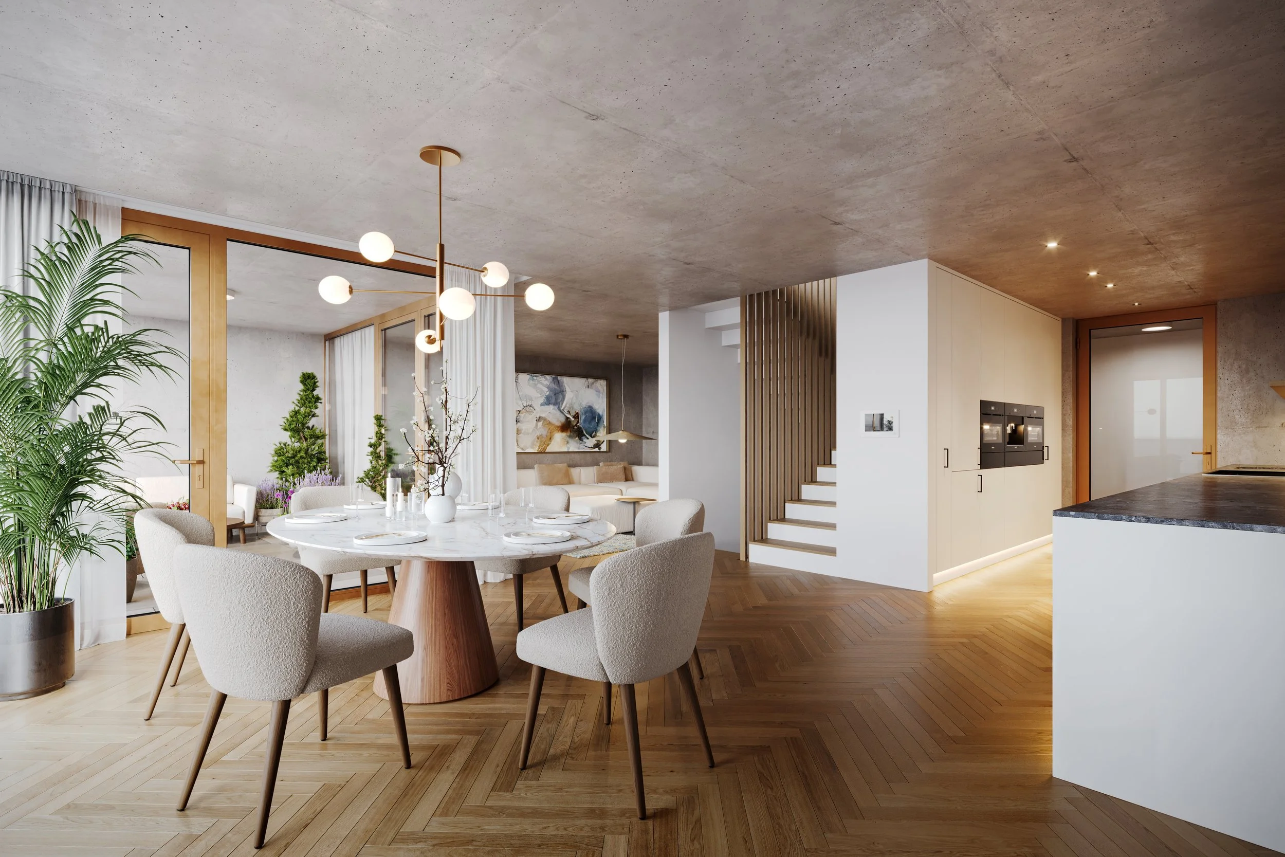 Modern open-concept living and dining area with a round marble dining table, beige cushioned chairs, a chandelier, green plants, a staircase, and built-in kitchen appliances.