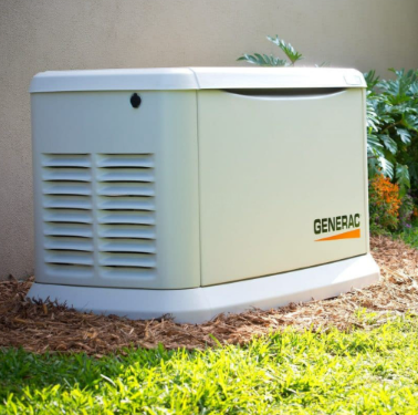 Generac generator outside on grass near plants