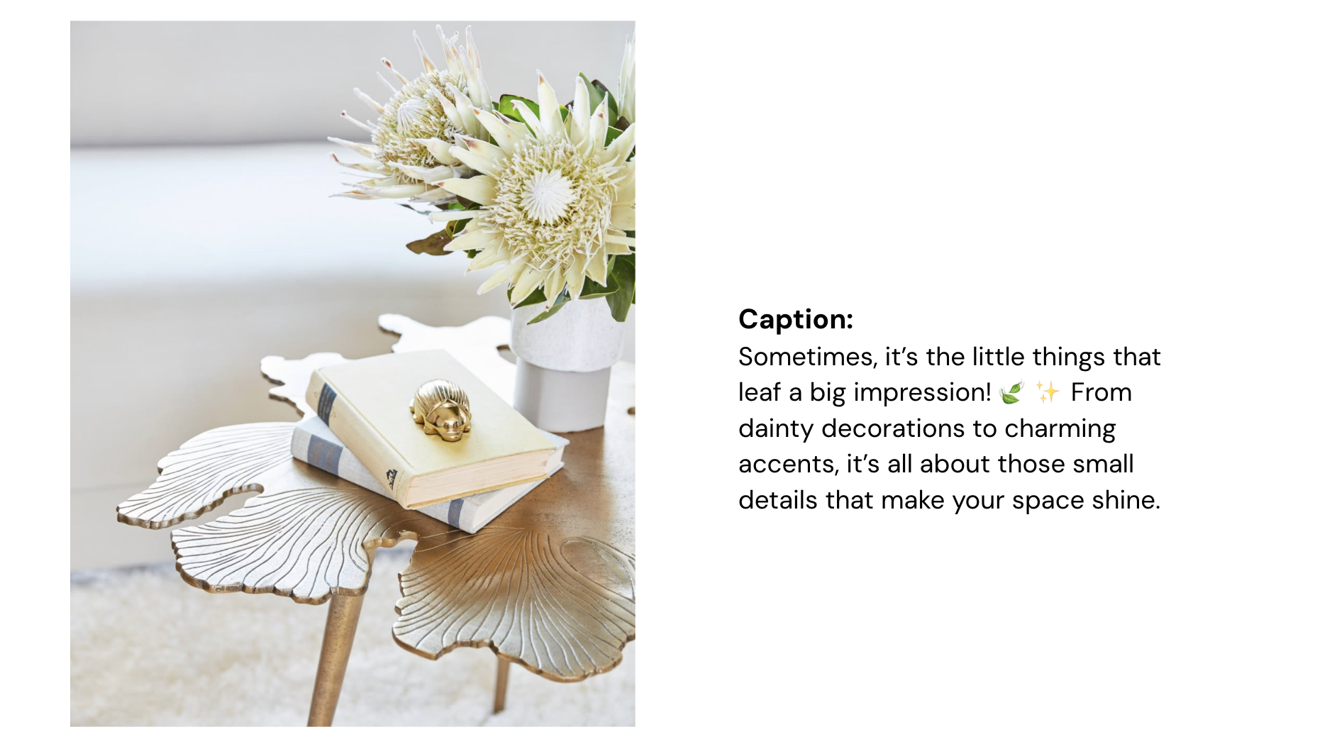 A decorative table with a white floral arrangement, a gold decorative object on top of a closed book, and a book underneath on a surface shaped like a leaf.