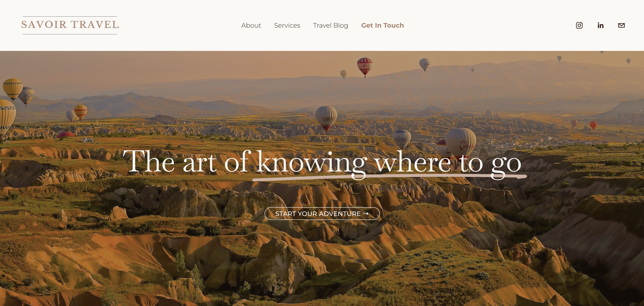 Scenic landscape with numerous hot air balloons floating over rocky terrain and distant mountains during sunset.