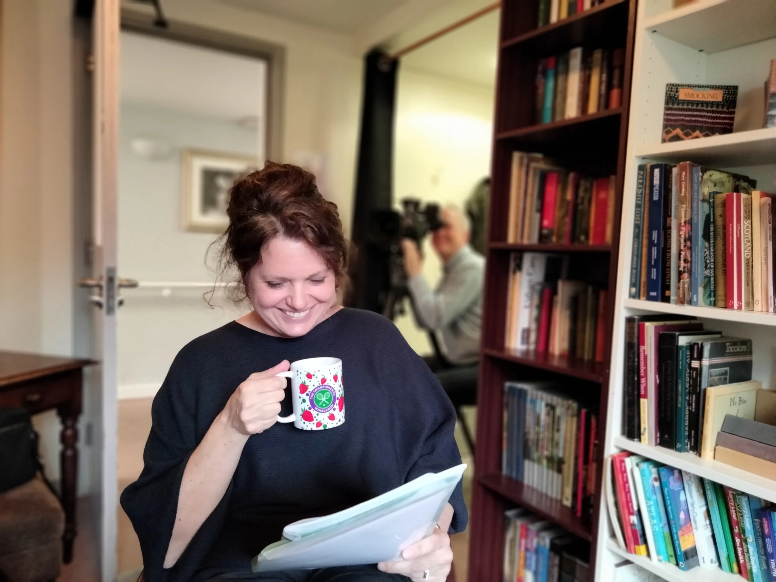Co-founder Suzannah Wander, reading her notes before directing a Legacy Film commissioned to celebrate a significant birthday
