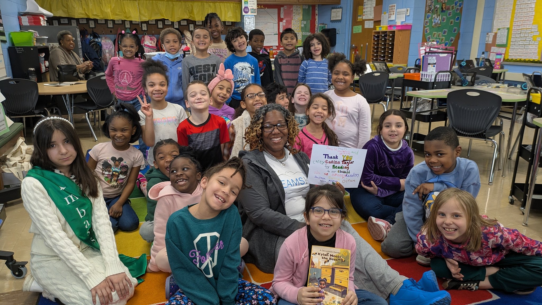 Author and kids in classroom