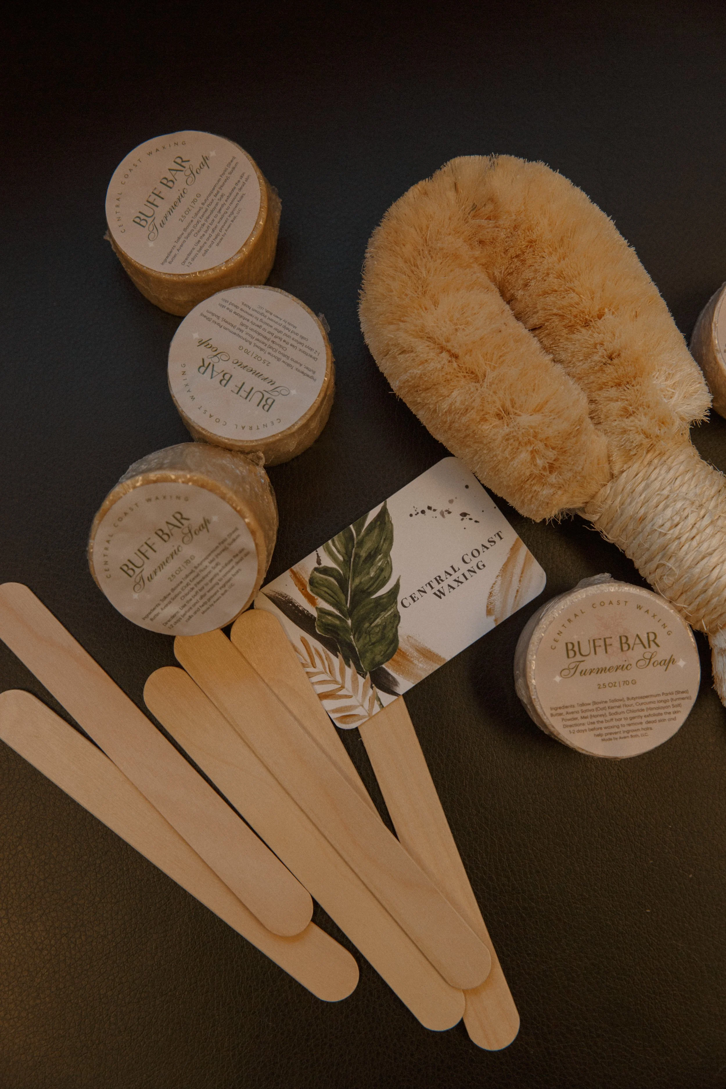 Spa products and waxing supplies at Central Coast Waxing in Orcutt, CA including exfoliating, buff bars, and professional Brazilian, waxing tools.