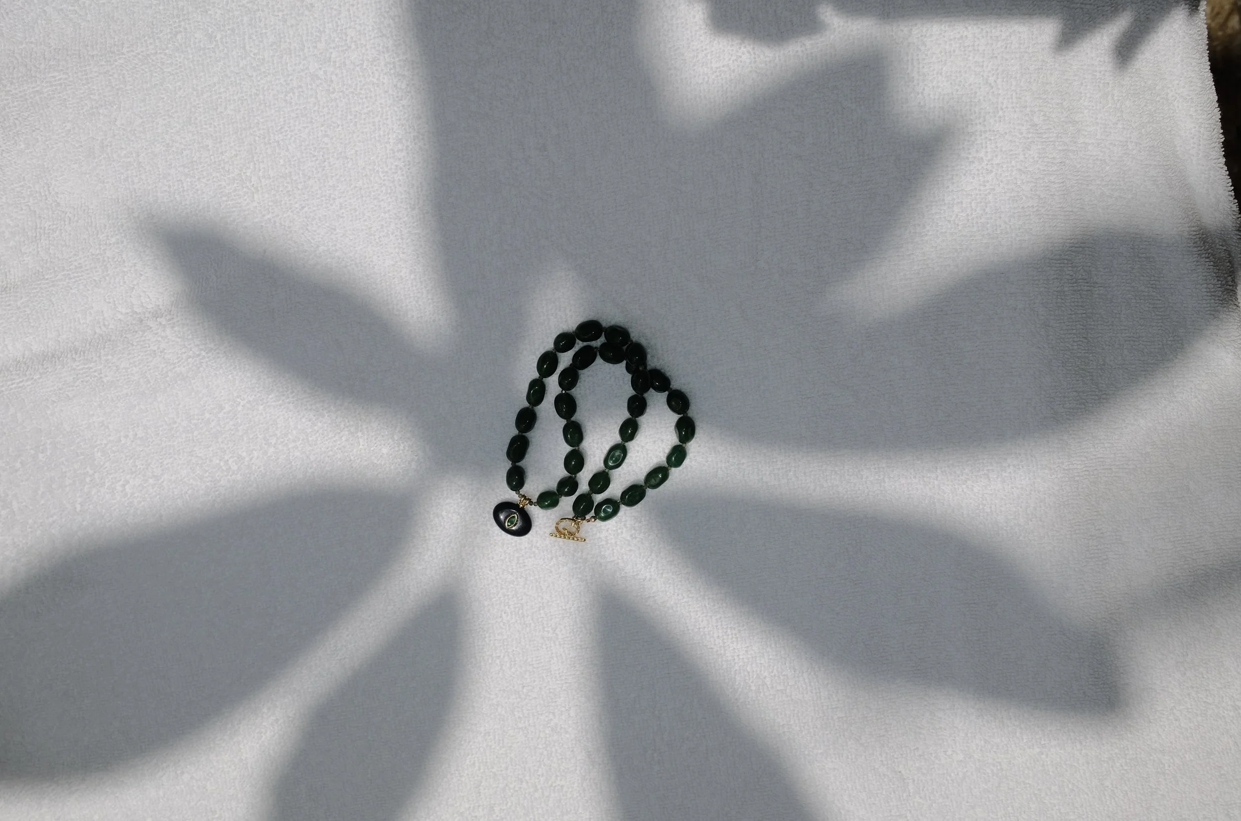 Green Jade Oval Necklace with Evil Eye Pendant