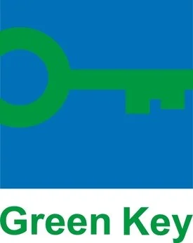 Label Clé verte sur fond bleu avec le texte 'Green Key' en dessous.