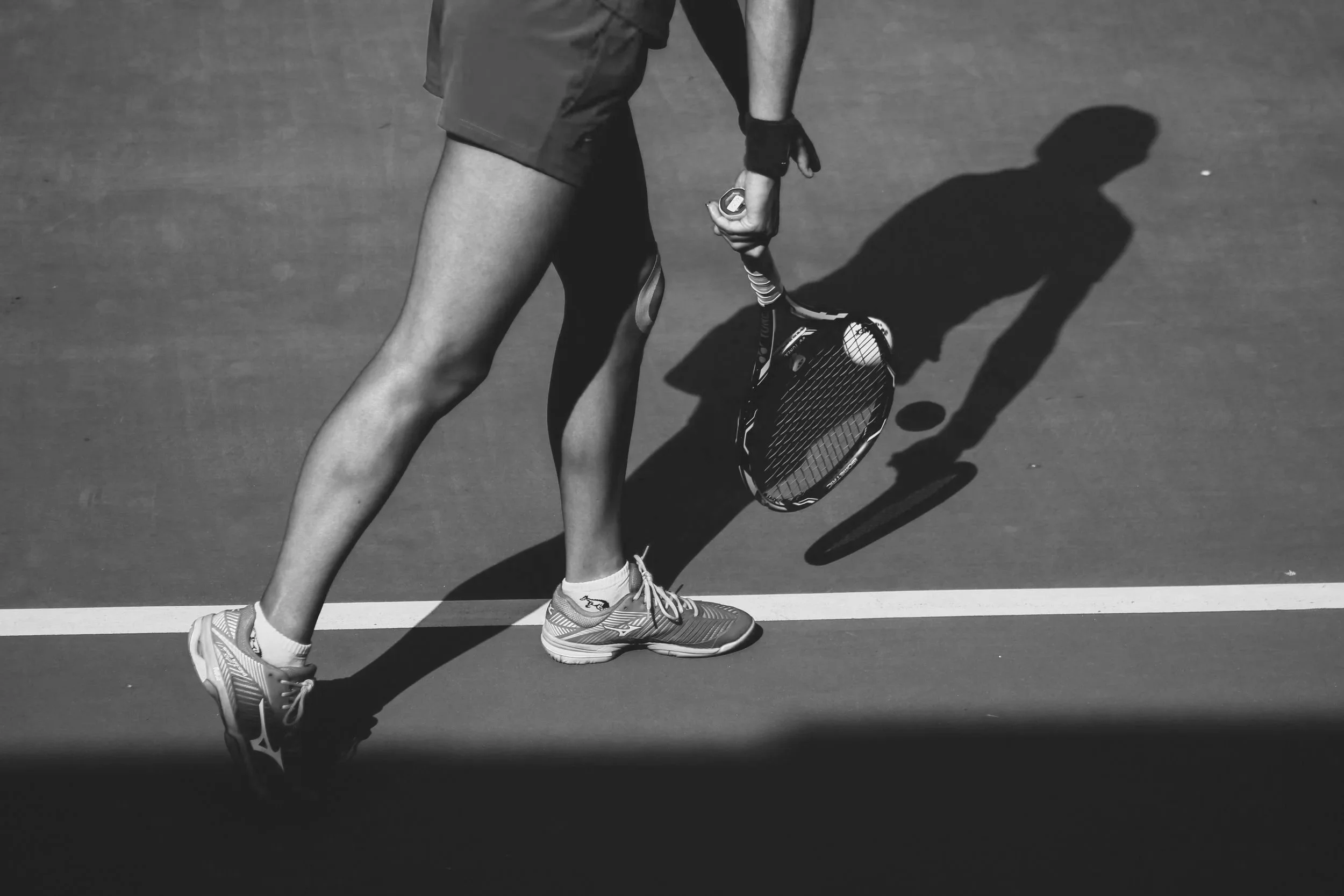Tennis player preparing to serve