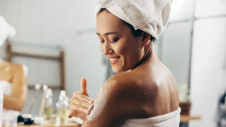 lady applying lotion on arm.jpg