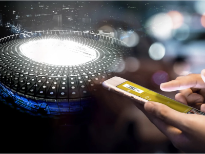 Close-up of a person holding a smartphone, with a city street and blurred lights in the background, and a futuristic circular digital interface overlay.