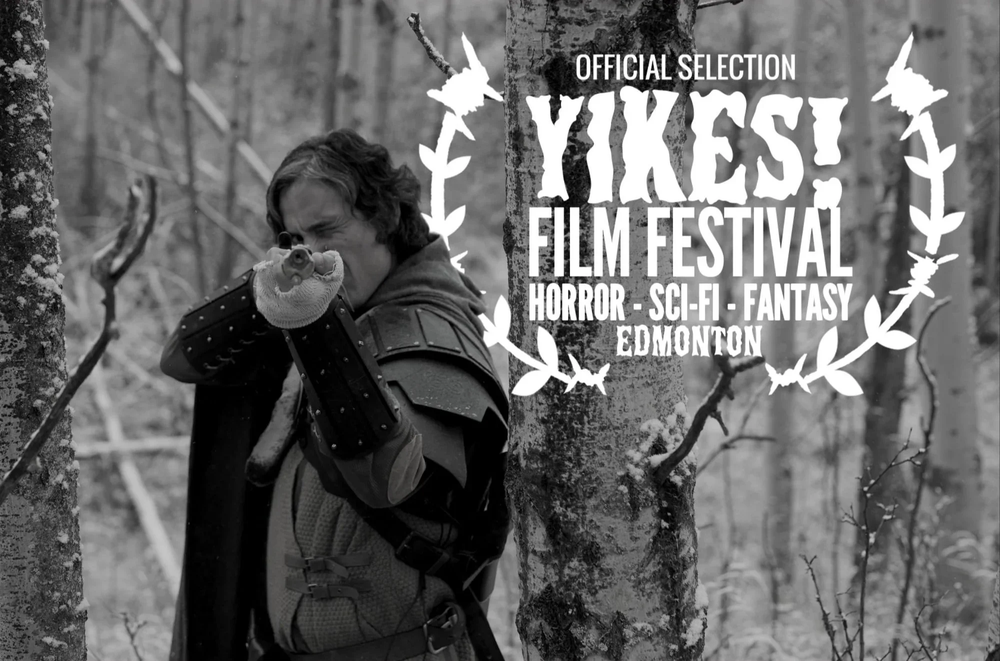 Scene from H&HA showing a black and white photo of a person in fantasy style armor aiming a rifle in a forest, with a promotional poster overlay for the YIKES! film festival in Edmonton.