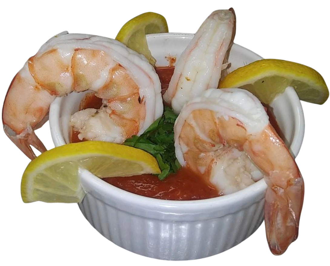 Shrimp cocktail served in a white ramekin with lemon wedges and a side of cocktail sauce, garnished with parsley.