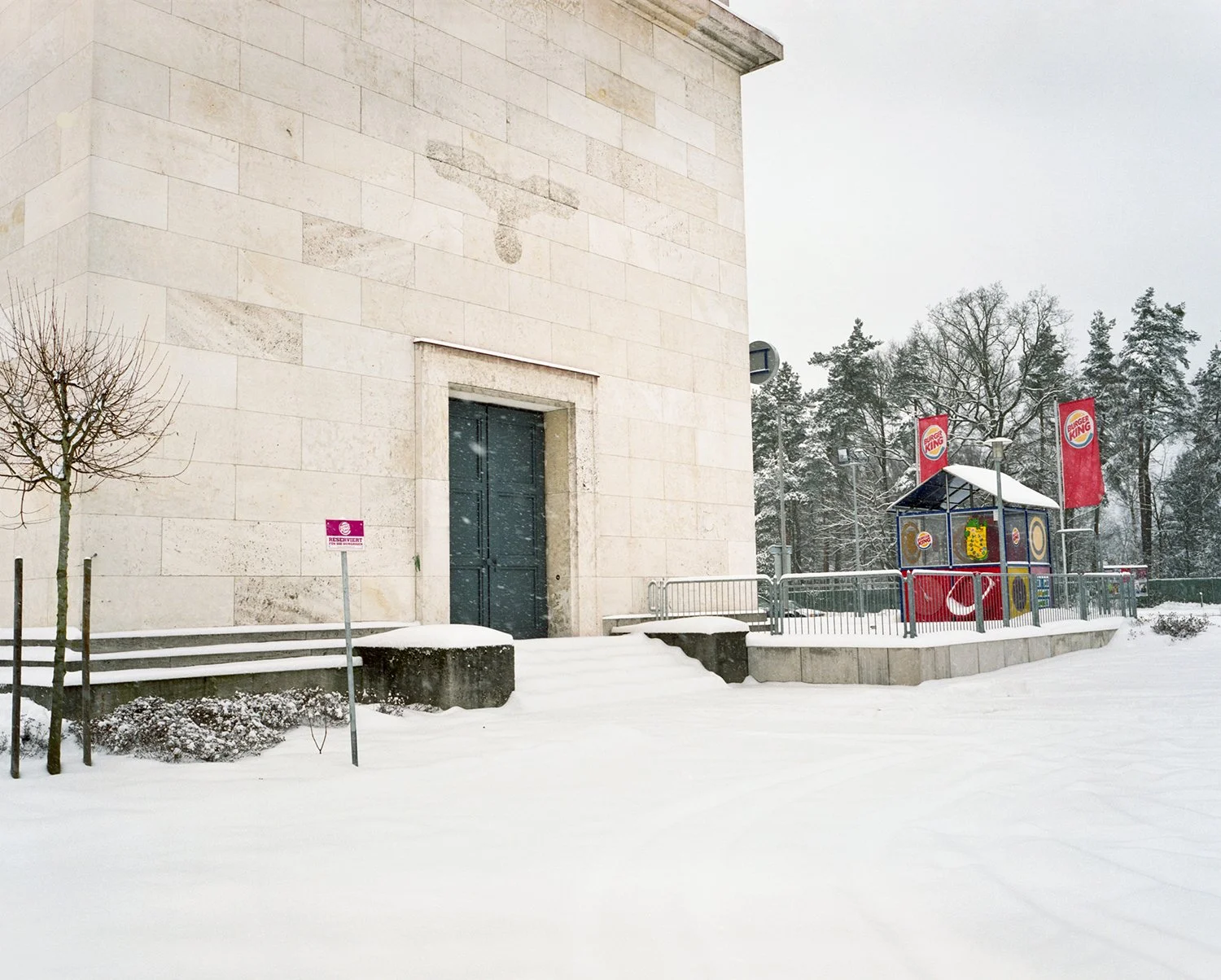 Transformer Station, Nürnberg, 1934 / 2011.
Originally constructed to supply power to the Reich Party Rally Grounds, the transformer station now houses a Burger King. A small parking sign on the left reads “Reserviert für die Hungrigen” (“Reserved fo