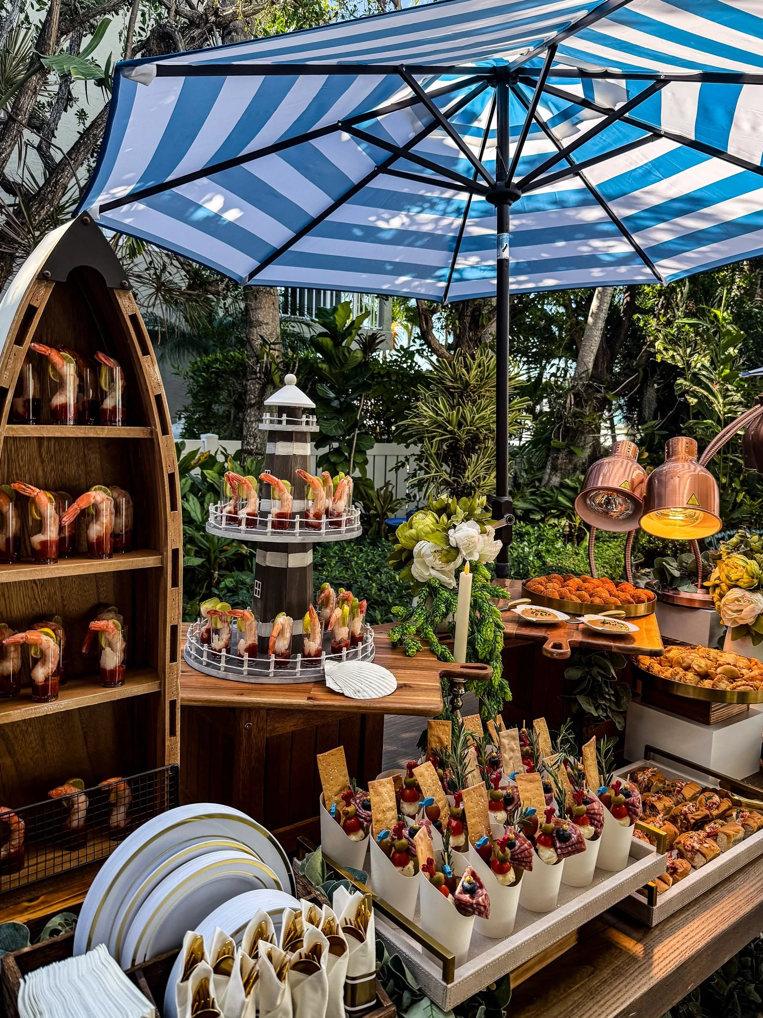 Luxury outdoor garden party catering by Francesca’s Catering in Miami featuring shrimp cocktail station, gourmet appetizers and elegant décor.