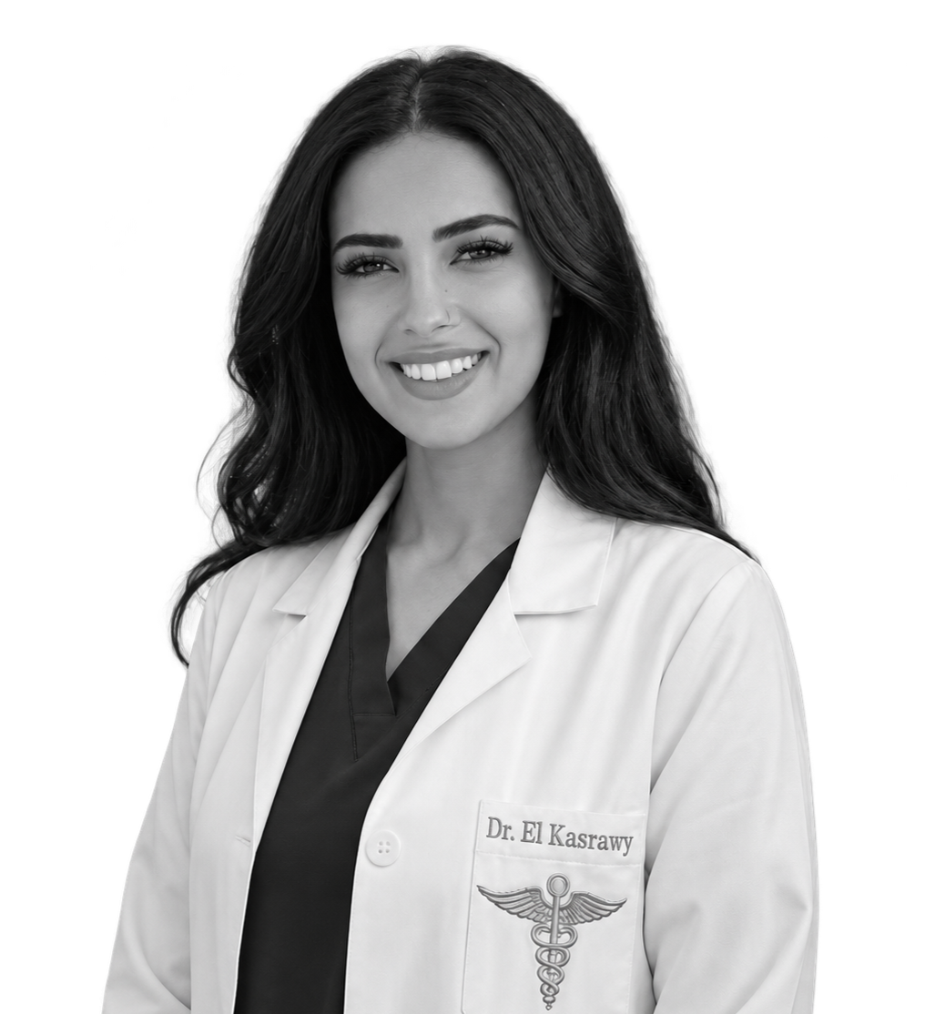 Black and white portrait of a smiling woman doctor with long dark hair, wearing a white medical coat with a name tag that reads 'Dr. El Kasrawy' and a caduceus symbol, against a black background.