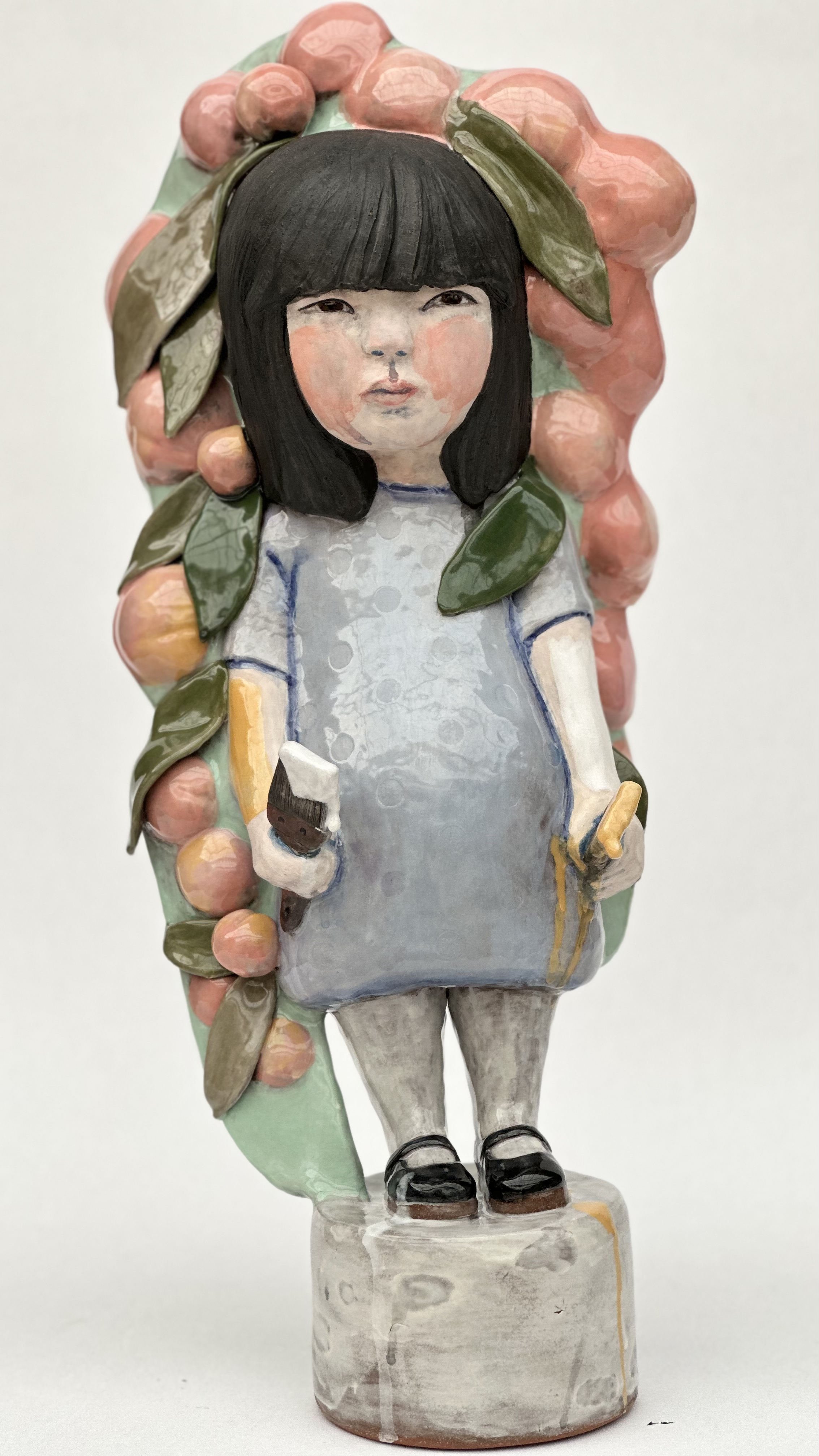 The Quiet Dragon, 2023, 24 in. x 10 in. x 10 in.
This piece symbolizes my daughter's dual identity in White and Asian cultures. She paints herself white and yellow, embodying the stereotypes that society often imposes, whether she agrees with them or