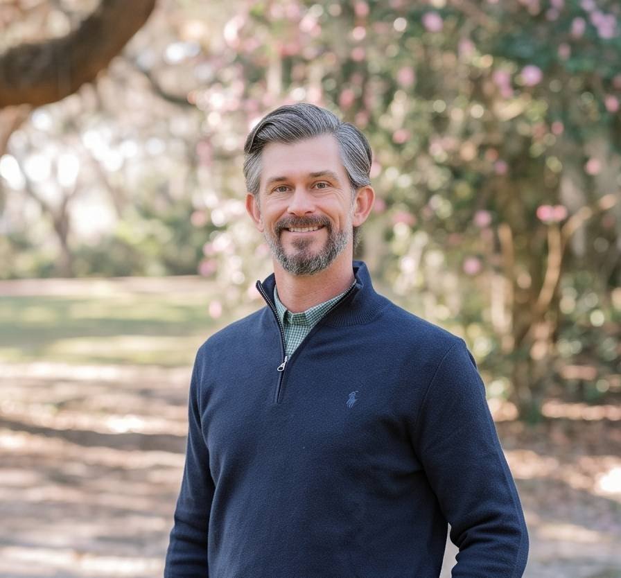 A man smiling with good hair.