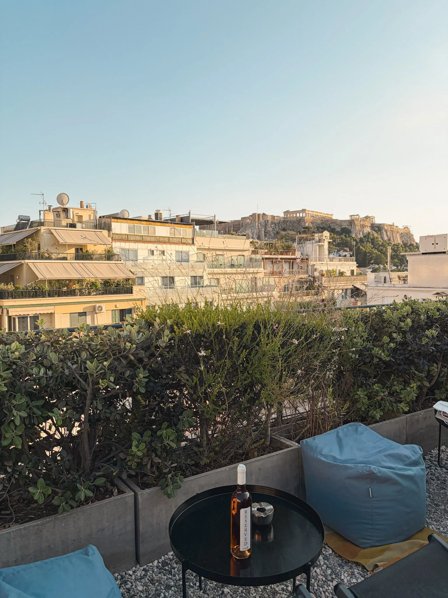 Rooftop views of the acropolis and casual lounge serves creative cocktails & wood-fire flatbreads.