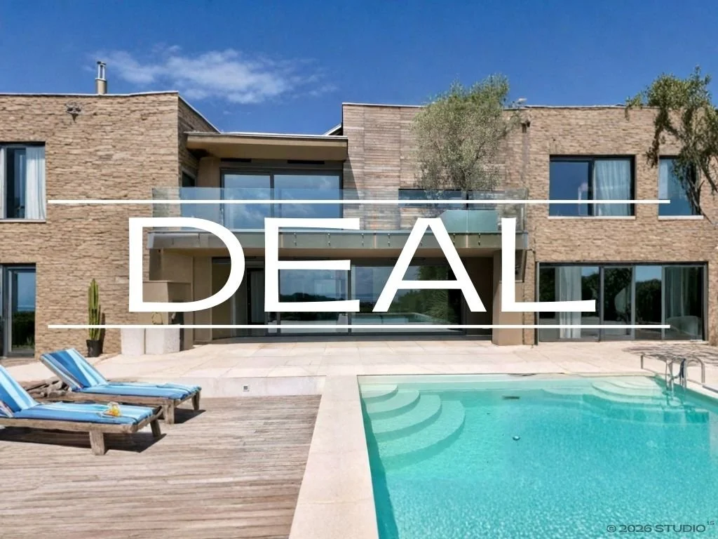 Modern house with large windows, a swimming pool, and lounge chairs in the backyard. The word 'DEAL' is overlaid across the image.