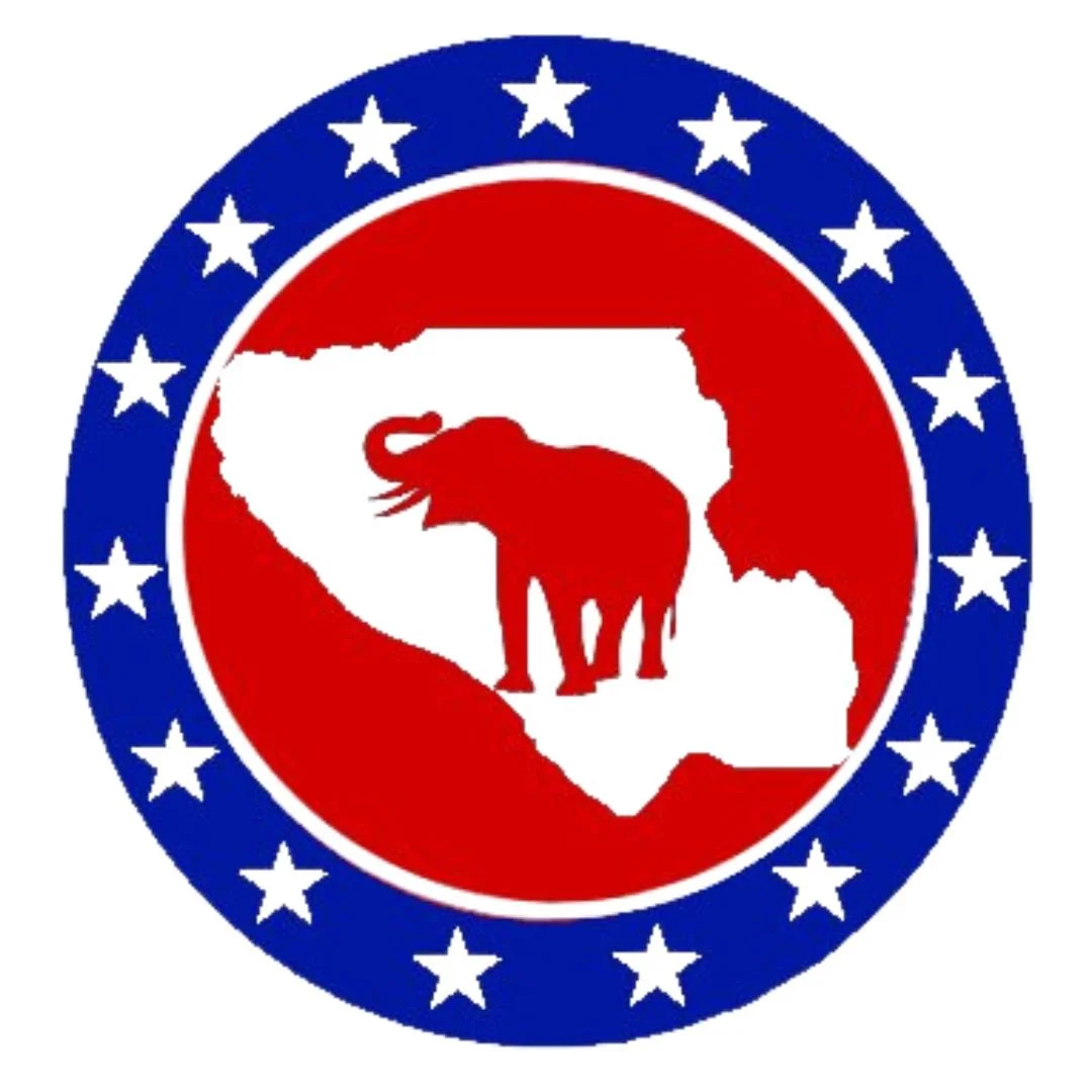 Santa Clare County Republican Party circular emblem with a blue outer ring and white stars, a red inner ring, and a white shape of Santa Clara County in California in the center. Inside, there is a silhouette of an elephant.